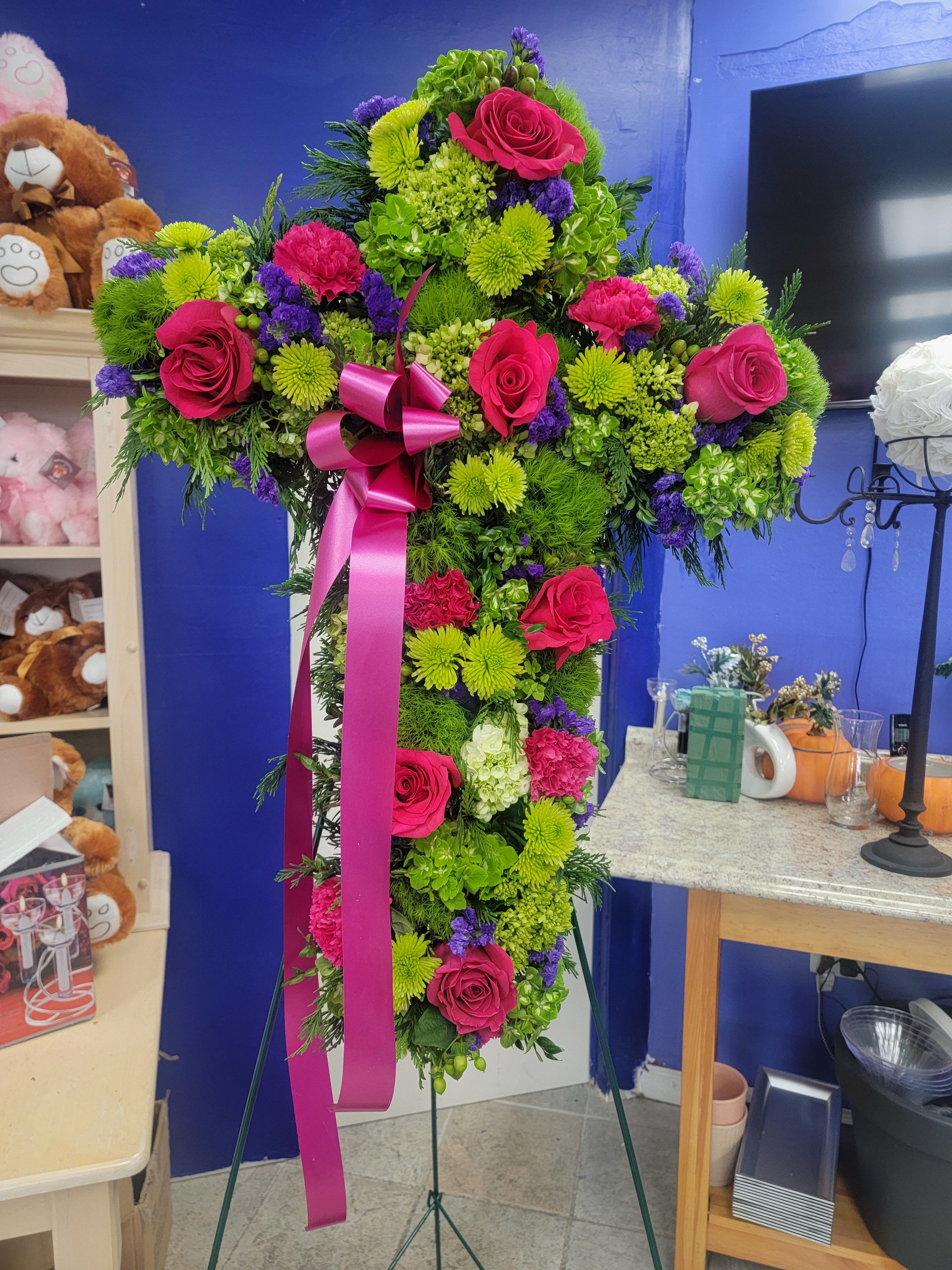 Hopeful Cross - Large arrangement in the shape of cross. Includes hot pink roses, hot pink carnations, white hydrangeas, purple carnations, and greens.