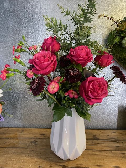 Half Dozen Roses Arrangement - 6 Roses arranged in a nice container (colors and actual pot used subject to availability)  Please call shop for details or specific requests. 