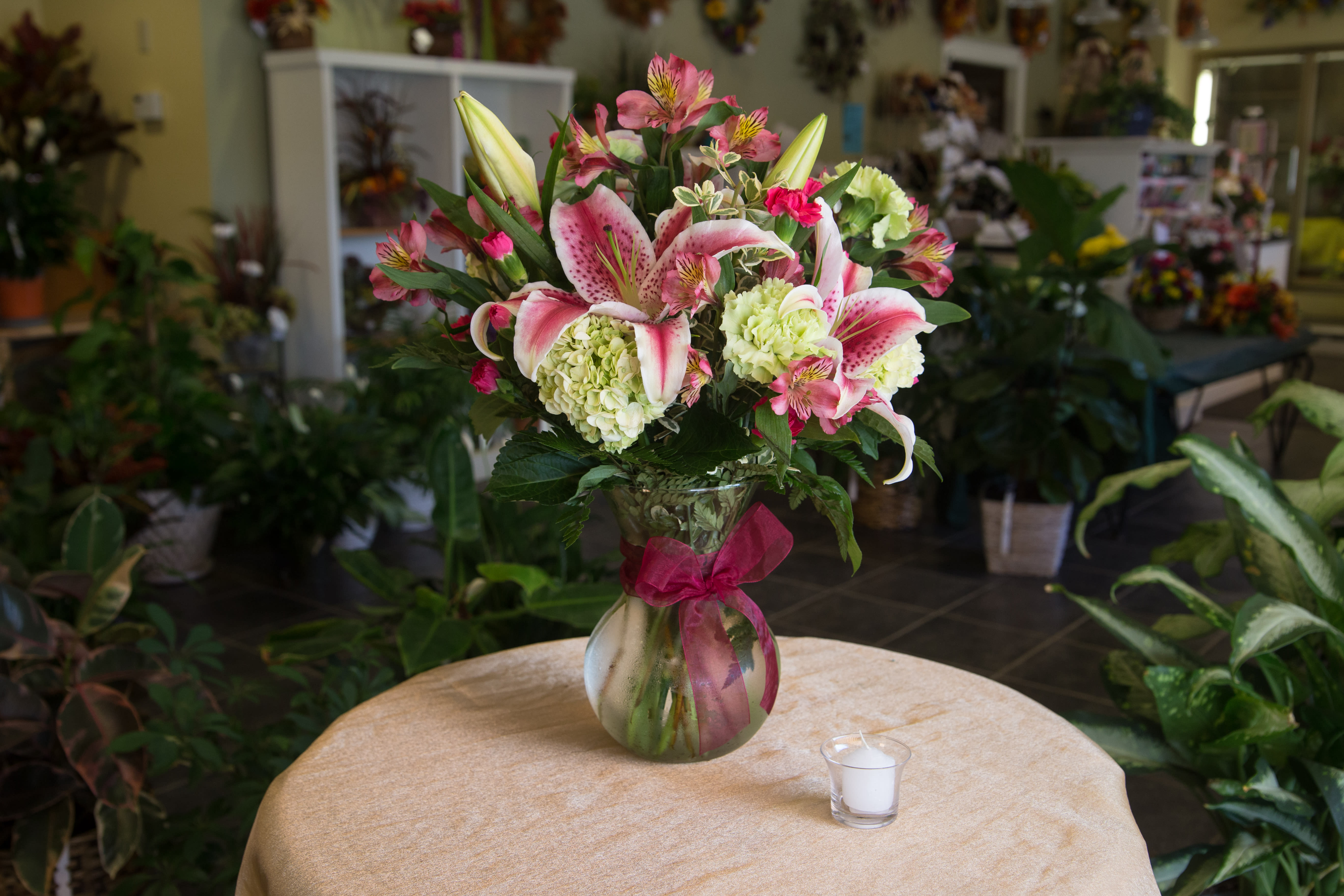 Starry Night - Dramatic star gazer lilies make this a special arrangement. There are also green hydrangeas and other mixed flowers to complete the bouquet.