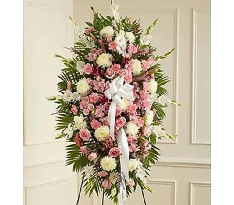 Pink and White Standing Sympathy Spray - Support the friends and family of a lost loved one with a pink and white standing sympathy spray.