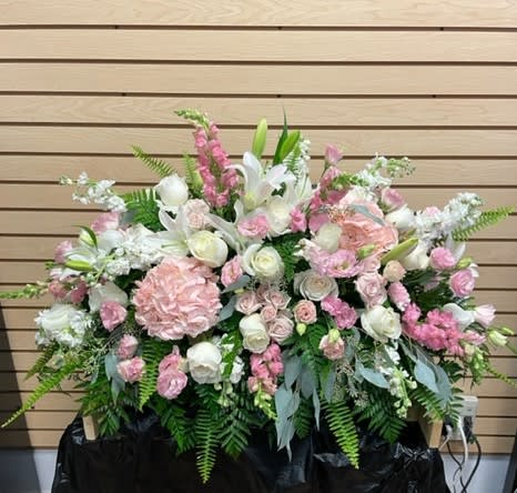Pink and White Casket Spray - Half Size Casket Spray with light pink spray roses, hydrangea, lisianthus, snapdragons, white roses, lilies, and stock with mixed greenery. 