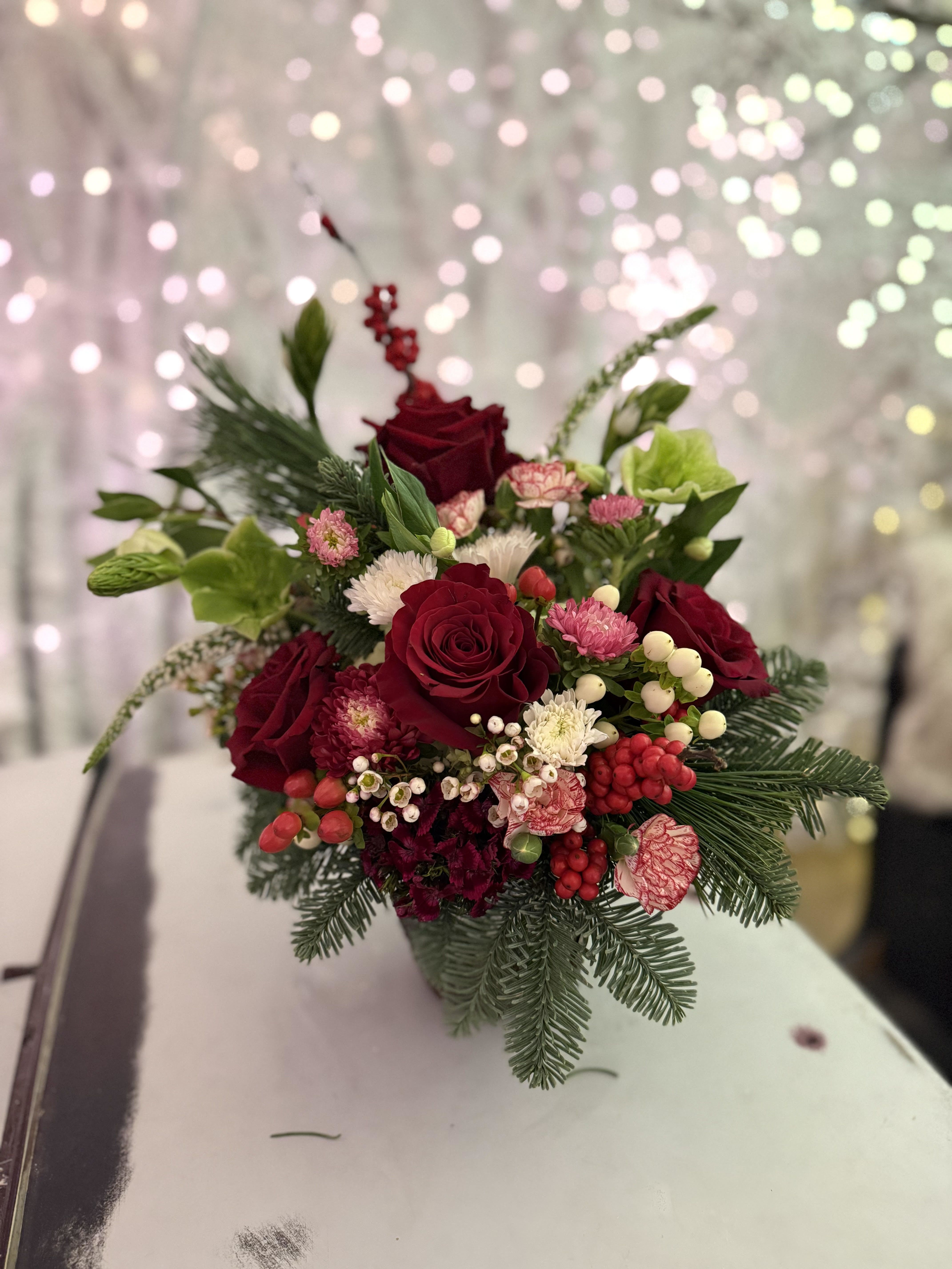 Holiday Arrangement - A festive take on our traditional floral arrangement. Give the warmth and joy of the Christmas season to someone you love!