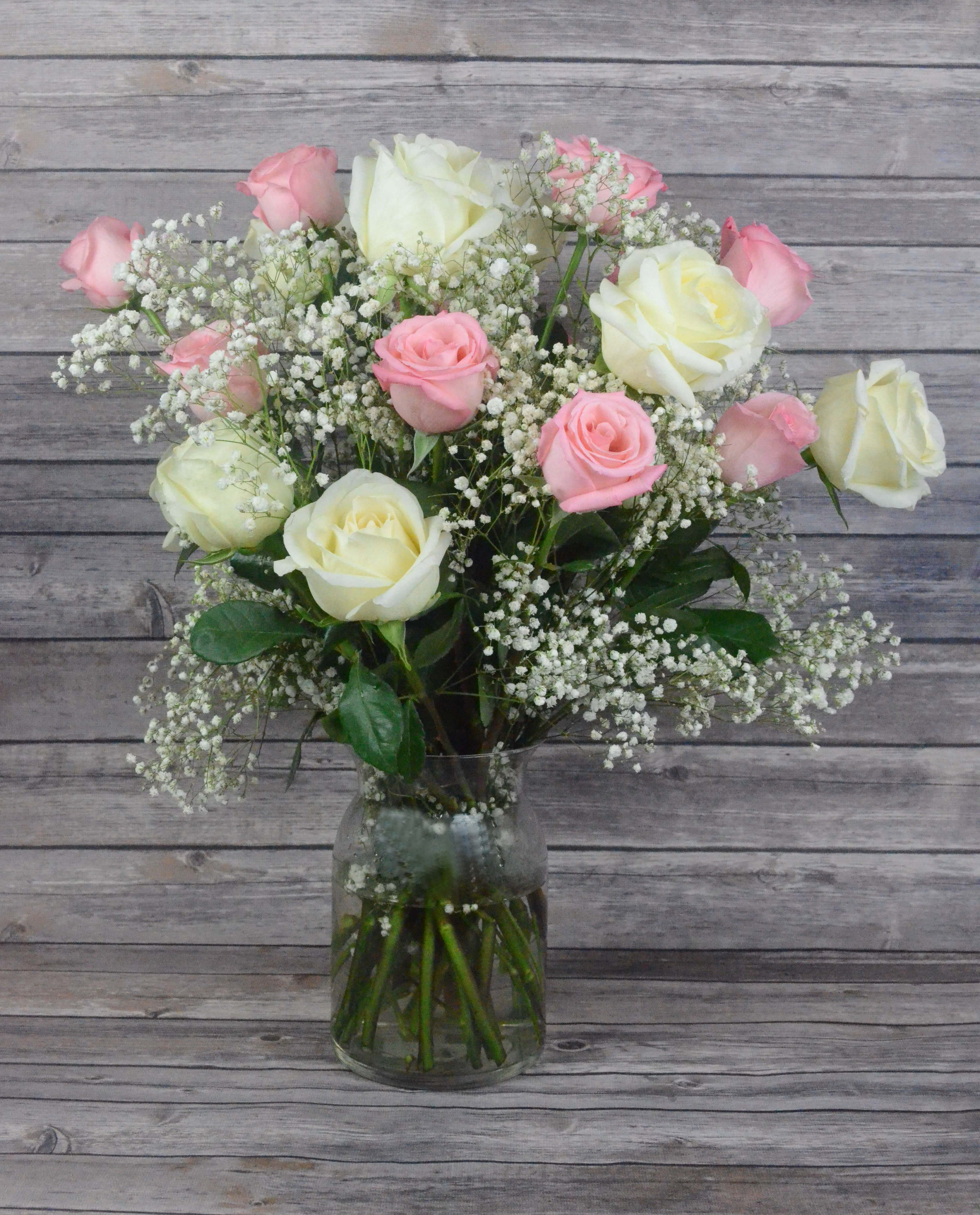 So Sweet - The perfect collaboration of pink and white, just right for any occasion. All bouquets are arranged by our professional floral design team accented with seasonal filler (i.e. greenery, baby’s breath, etc.) inside an elegant glass vase or gift box. Blooms are hand delivered in person to enhance any celebration or a “just because” surprise. Our team selects the freshest flowers available, so shade of rose may vary due to seasonal availability. When artistically designed in a clear glass vase arrangement measures approximately 23&quot;H x 18&quot;L.