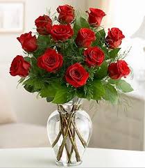 Dozen Red Roses Special - 12 Red Roses arranged in vase with upscale greens and fillers. (other colors available 