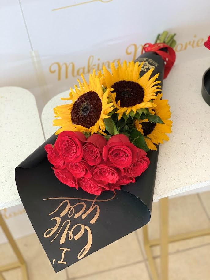 Bouquet 24 roses - 3 Sunflowers Bouquet 24 roses - 3 Sunflowers - Indulge in luxury with our stunning Bouquet 24 Roses - 3 Sunflowers. Featuring 24 vibrant red roses and 3 sunny sunflowers, this bouquet is the epitome of elegance and sophistication. Perfect for any special occasion like Birthday or Anniversary, it's sure to make a statement and leave a lasting impression.