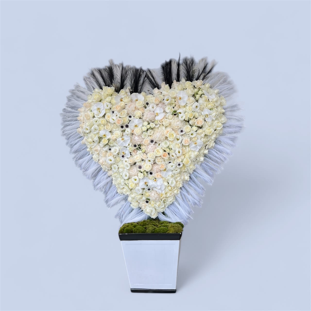 Puro corazón  - A beautiful heart shaped arrangement of white roses and pink cymbidiums. One of LA Premier's own signature hand made heart design ! It stands approximately 35 inches tall; the perfect height for just about anything!