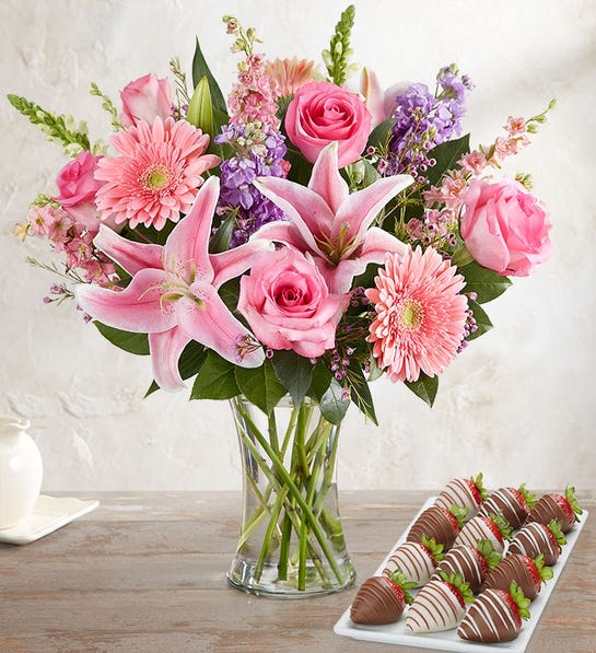 Mother's day your always on mind with love Mother's day your always on mind with love - EXCLUSIVE A special pairing for that someone special on your mind. Start with our exclusive, garden-inspired bouquet in shades of pink and purple. Finish it off with our decadent dipped strawberries, perfect for savoring (and sharing). Both are handcrafted and delivered the same day and ready to delight, whatever the reason. Flowers: All-around Local Artisan arrangement with pink roses, Gerbera daisies, Oriental lilies and larkspur, white snapdragons and lavender stock Artistically designed in a clear glass gathering vase; measures 8"H Large measures approximately 23"H x 14"W Medium measures approximately 22"H x 13"W Small measures approximately 21"H x 12"W Our florists select the freshest flowers available, so colors, varieties and container may vary due to local availability To ensure lasting beauty, Oriental lilies may arrive in bud form and will fully bloom over the next few days Each year, we bring together a select group of the most talented florists from across the country to create unique product concepts. Selected designs become part of the Local Artisan Collection and are available exclusively for delivery nationwide. Berries: 12 strawberries: 4 dipped in white chocolaty confection with milk chocolaty drizzle; 4 dipped in milk chocolaty confection with white chocolaty drizzle; 4 dipped in milk chocolaty confection with milk chocolaty drizzle