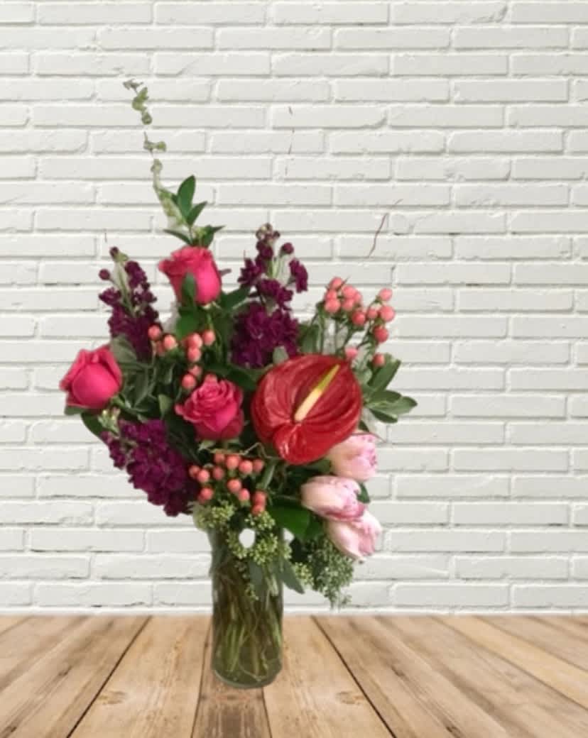 Heart Eyes Heart Eyes - A stunning love bouquet featuring a heart shaped anthurium! Including Roses, tulips, hypericum, & stock with assorted greenery in a vase.