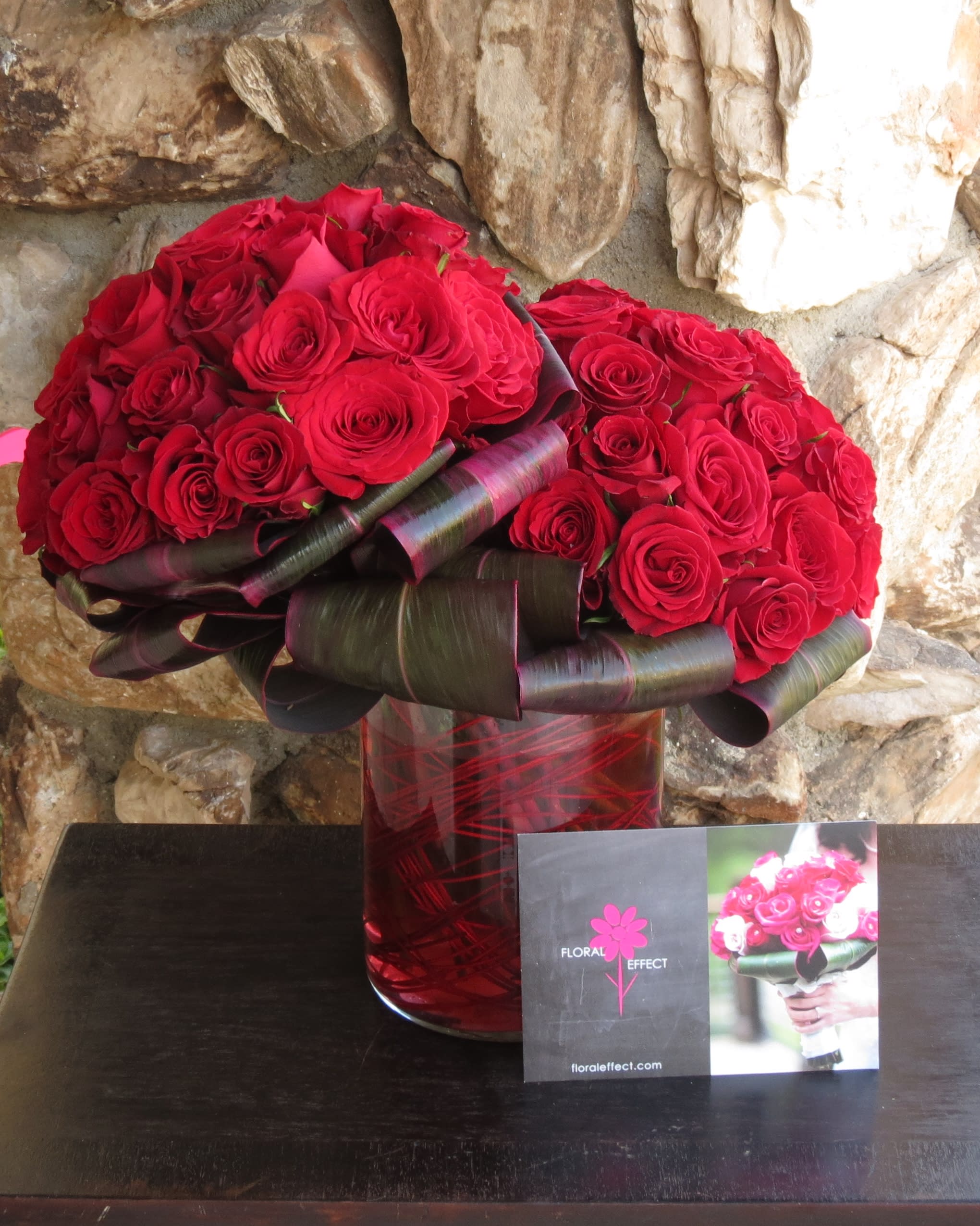 50 Red Roses - 50 Red Roses arranged on a glass vase