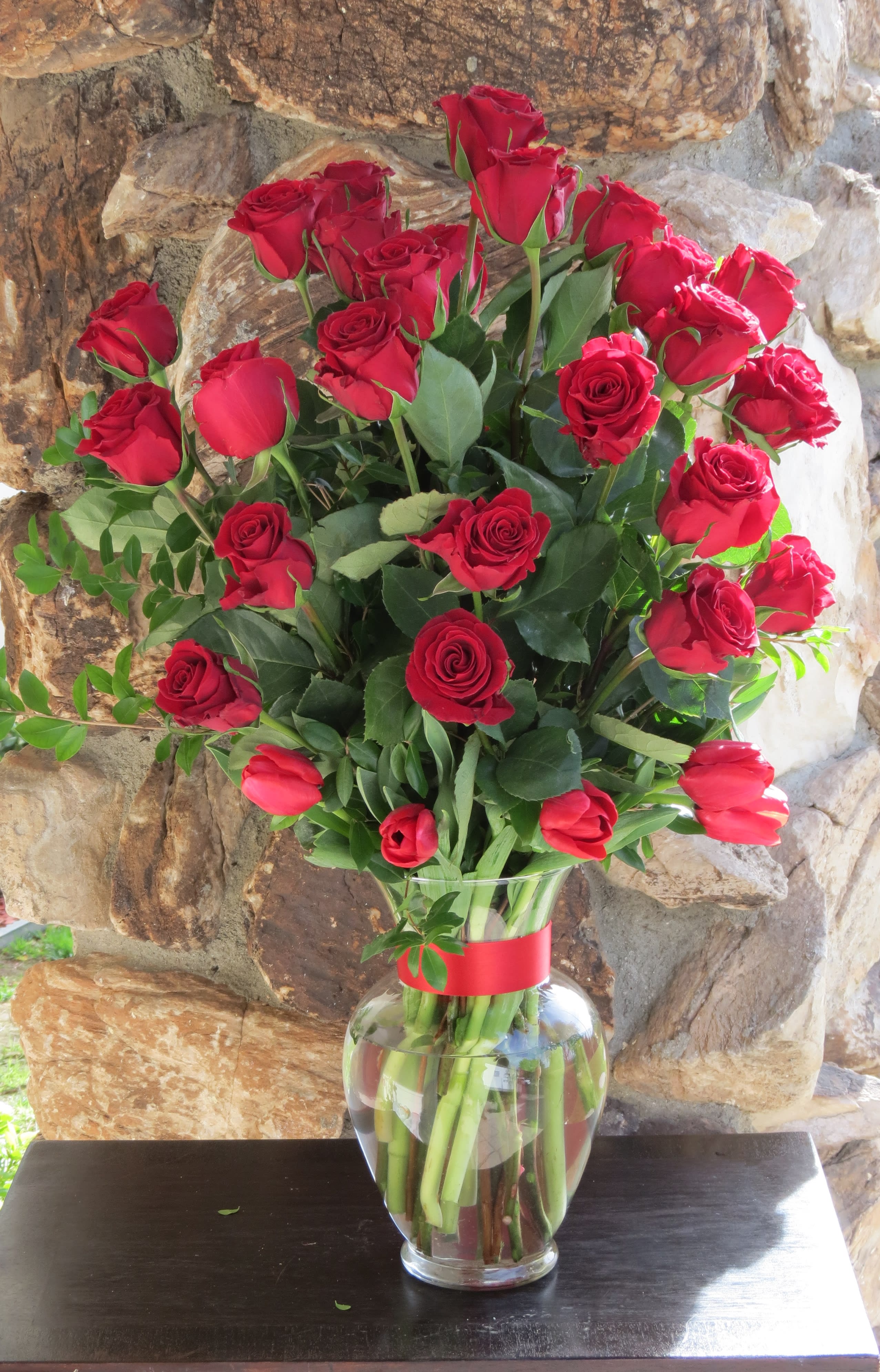 Red Roses  - 24 Red roses and tulips arranged on a glass vase