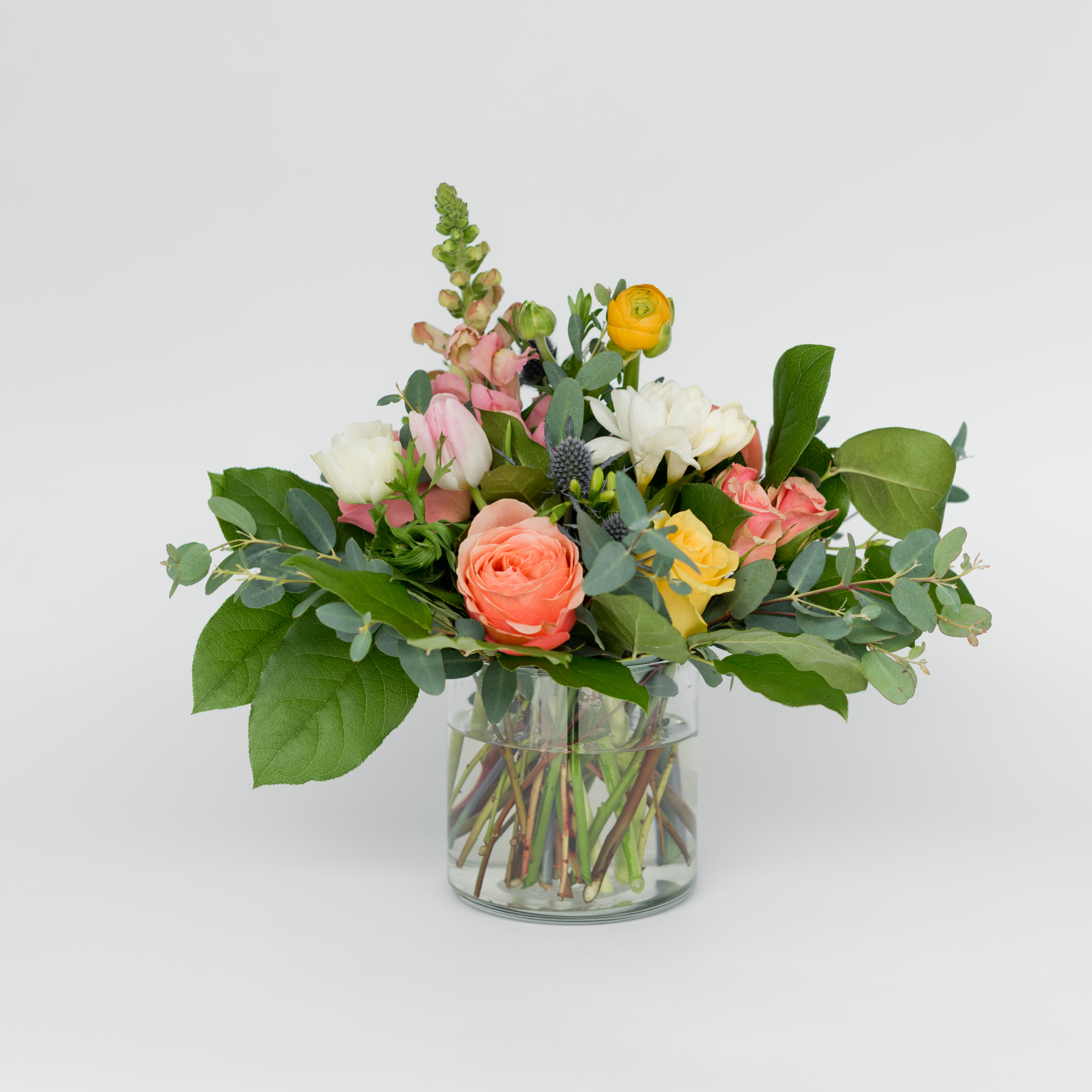 6 | chaumont - Seasonal blooms &amp; foliage in a clear petite vase.