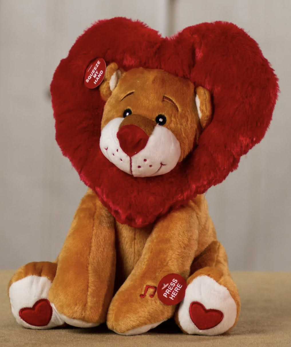 Dancing and Singing Lion - This great looking lion has a heart-shaped mane and belts out a great roaring version of &quot;Come and Get Your Love.&quot;   As with all of our musical items, this one comes with batteries included.