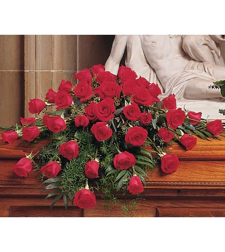 Blooming Red Roses Casket Spray - When you want to express how deep your love is this spray of red roses says it all. One casket spray arrives with forty-eight red roses arranged to gently fit on the caskets lid. 