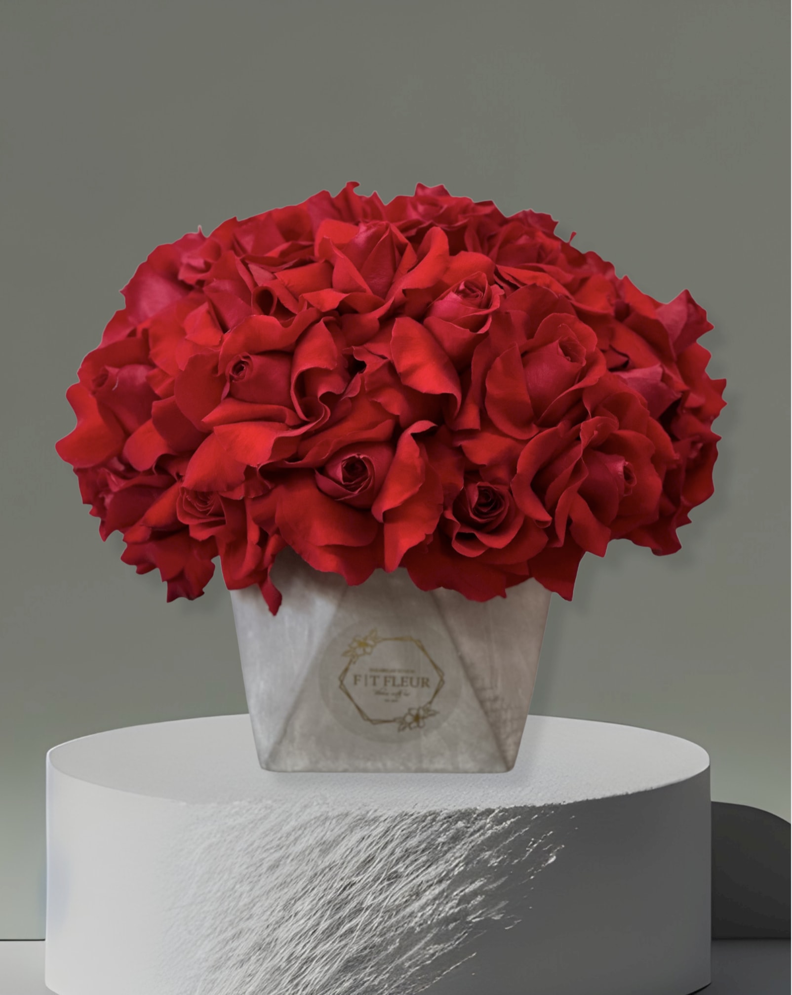 Loving you - Introducing our **Concrete Elegance** arrangement – a stunning display of red roses beautifully reflected in a sleek concrete base. This modern masterpiece combines the timeless beauty of vibrant red blooms with the contemporary charm of industrial design, creating a striking visual contrast.  Each rose is carefully arranged to showcase its rich color and delicate form, while the concrete base adds a touch of sophistication and durability. Perfect for contemporary spaces, this arrangement is ideal for special occasions or as a bold statement piece in your home or office. Experience the unique fusion of nature and design with our Concrete Elegance arrangement, and let it inspire your surroundings!