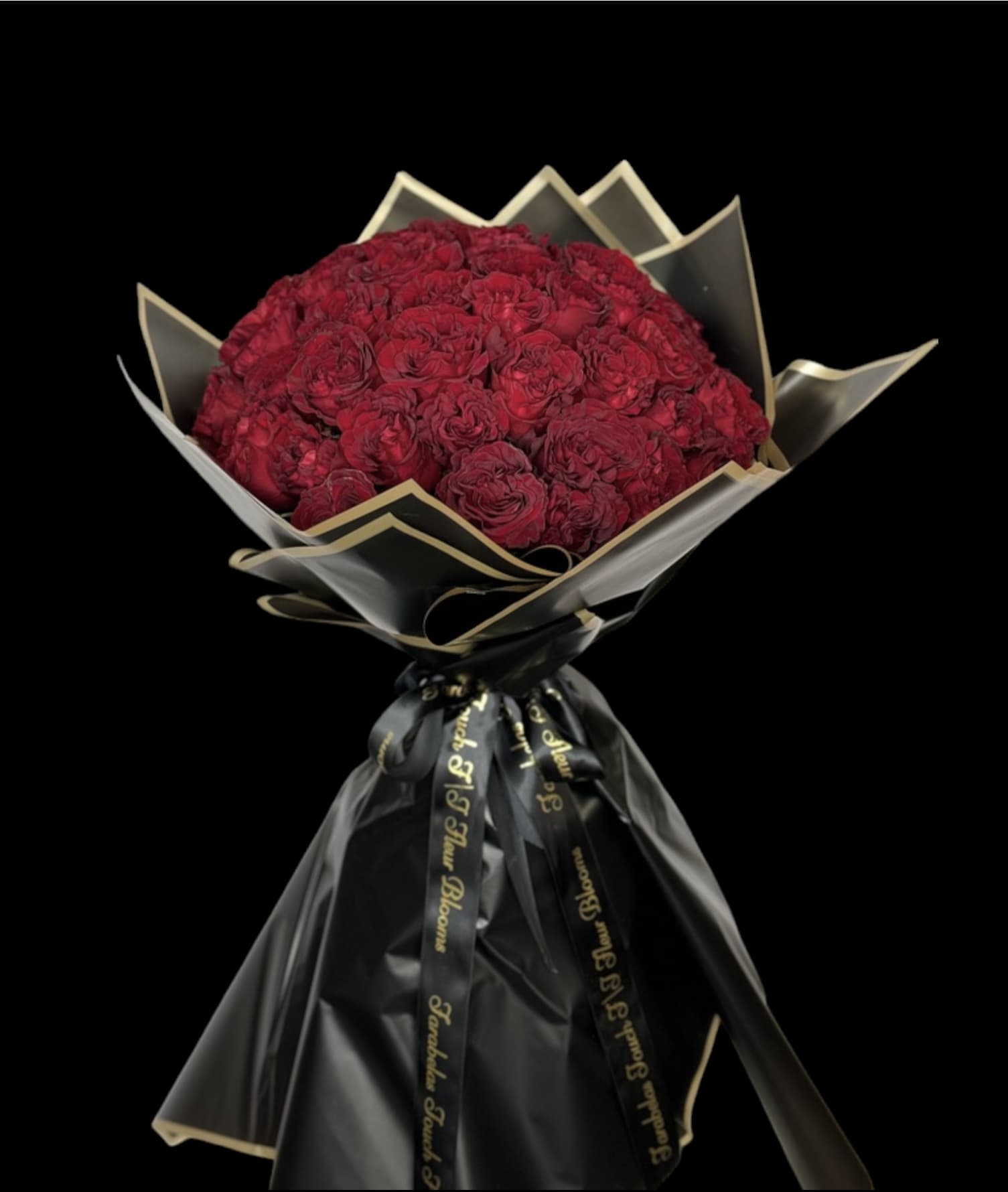 Red Romance lover’s  - Introducing our **Timeless Elegance Bouquet** – a stunning arrangement featuring 50 hand-tied red roses, beautifully wrapped in classic French paper. This long-lasting bouquet showcases the vibrant color and exquisite beauty of each rose, symbolizing love and admiration.  Meticulously crafted by our skilled florists, this hand-tied design offers a sophisticated touch, making it perfect for any occasion. The elegant wrapping not only enhances the visual appeal but also ensures the freshness of the blooms, allowing you to enjoy their beauty for weeks to come.  Gift this enchanting bouquet to that special someone or treat yourself to a lasting reminder of nature's splendor. Experience the allure of our Timeless Elegance Bouquet and let the romance of red roses brighten your space!