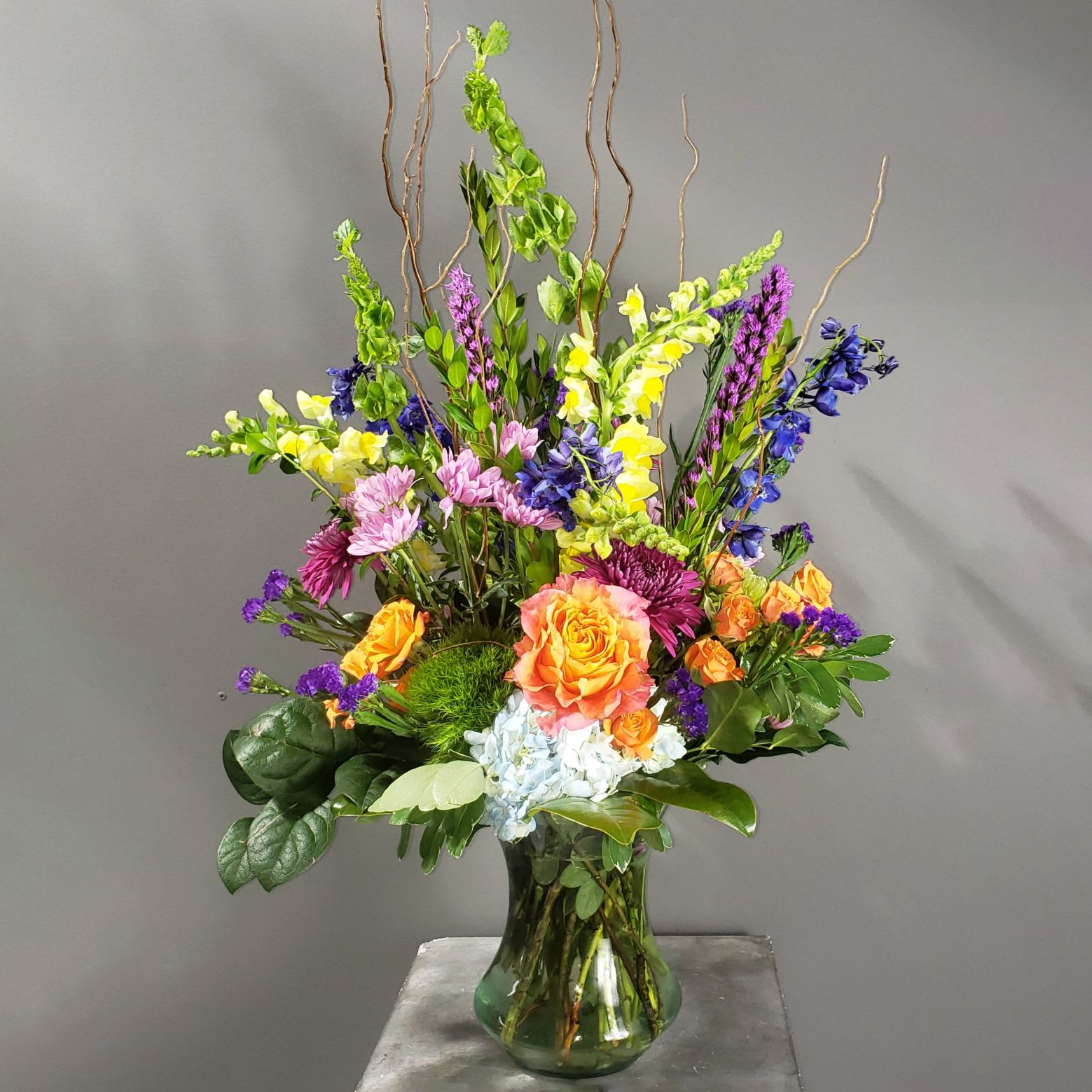 Sympathy Medley - This arrangement with its medley of flavors in color and variety is a beautiful sympathy arrangement to bring colorful thoughts to a loved one experiencing loss.
