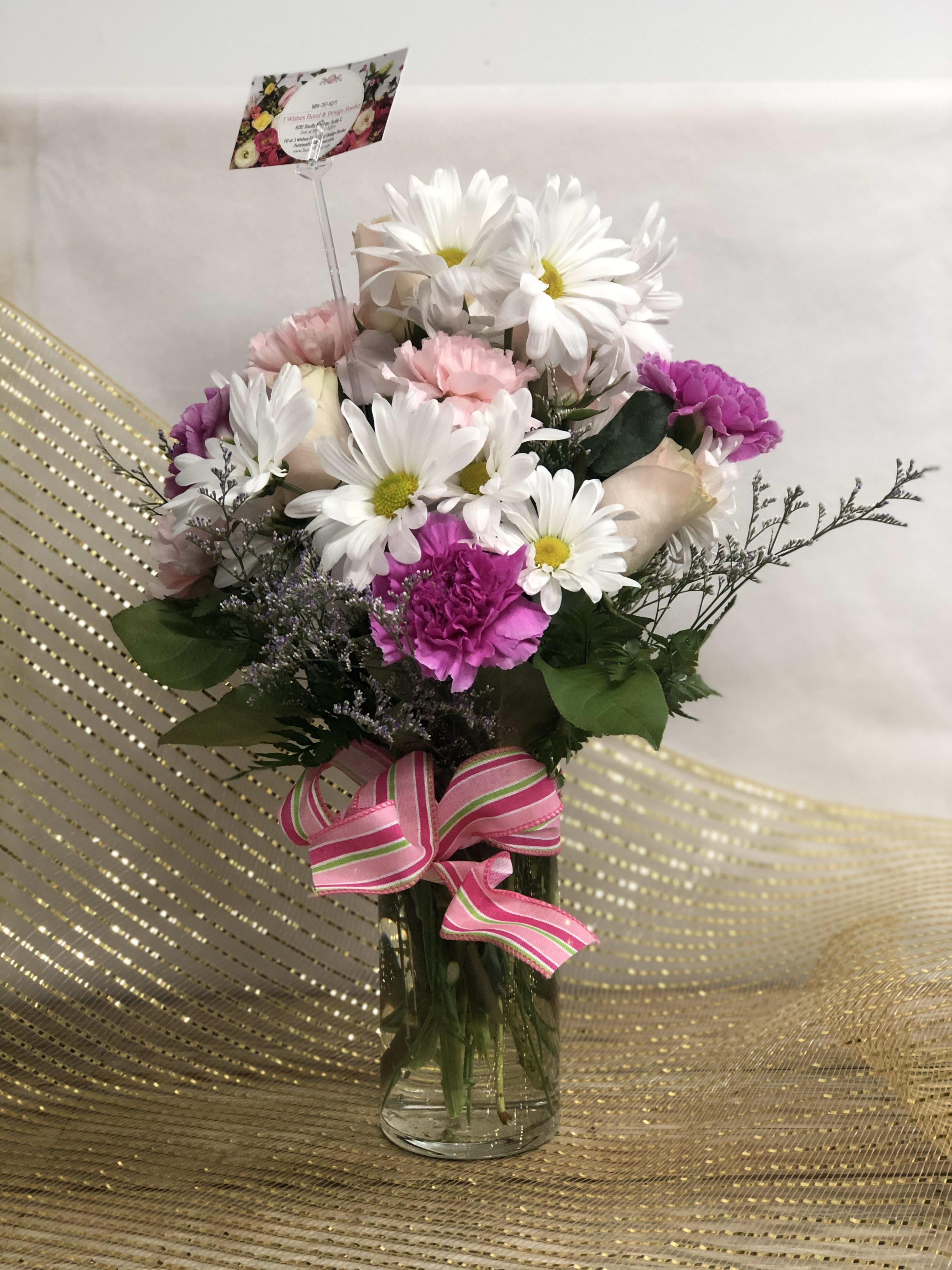 Sweet Wishes - Mixed arrangement in pink and white shades are sure to make someone's day.  Filled with roses, carnations, daisies and beautiful filler flower are perfect for any occassion. 