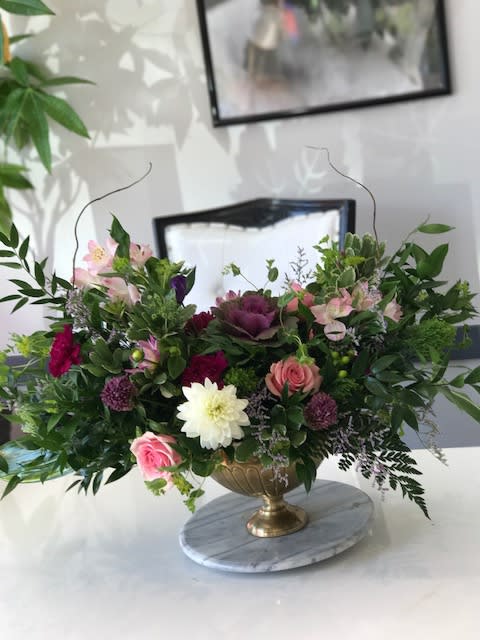 Sided modern arrangement - beautifully designed in flowy look with seasonal flowers
