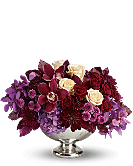 Lush and Love - orchids and roses mix with other flower in premium container