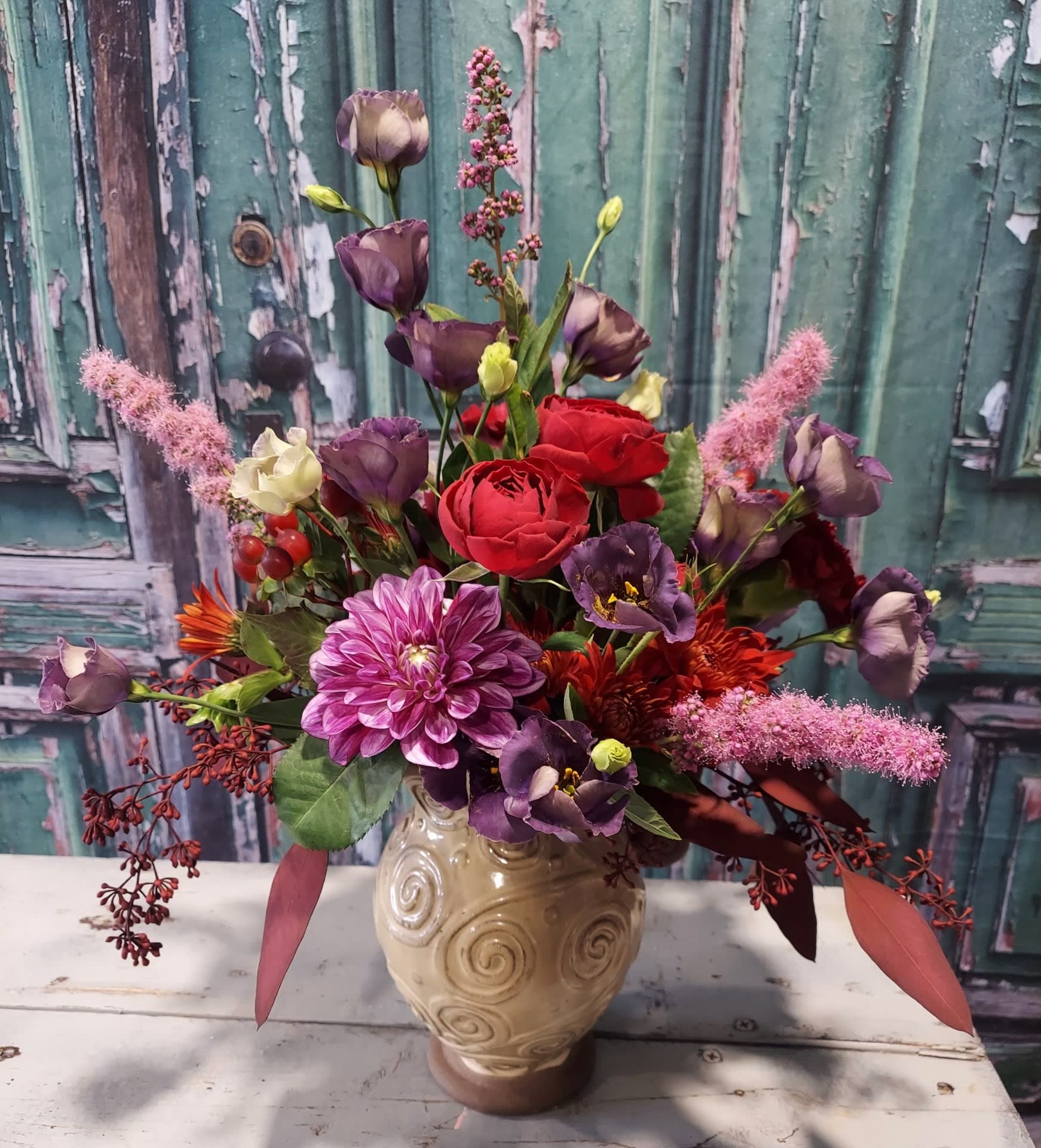 Plum Perfect Plum Perfect - A mixed bloom arrangement that is bold and beautiful in rich deep shades of purple, lavenders and reds.