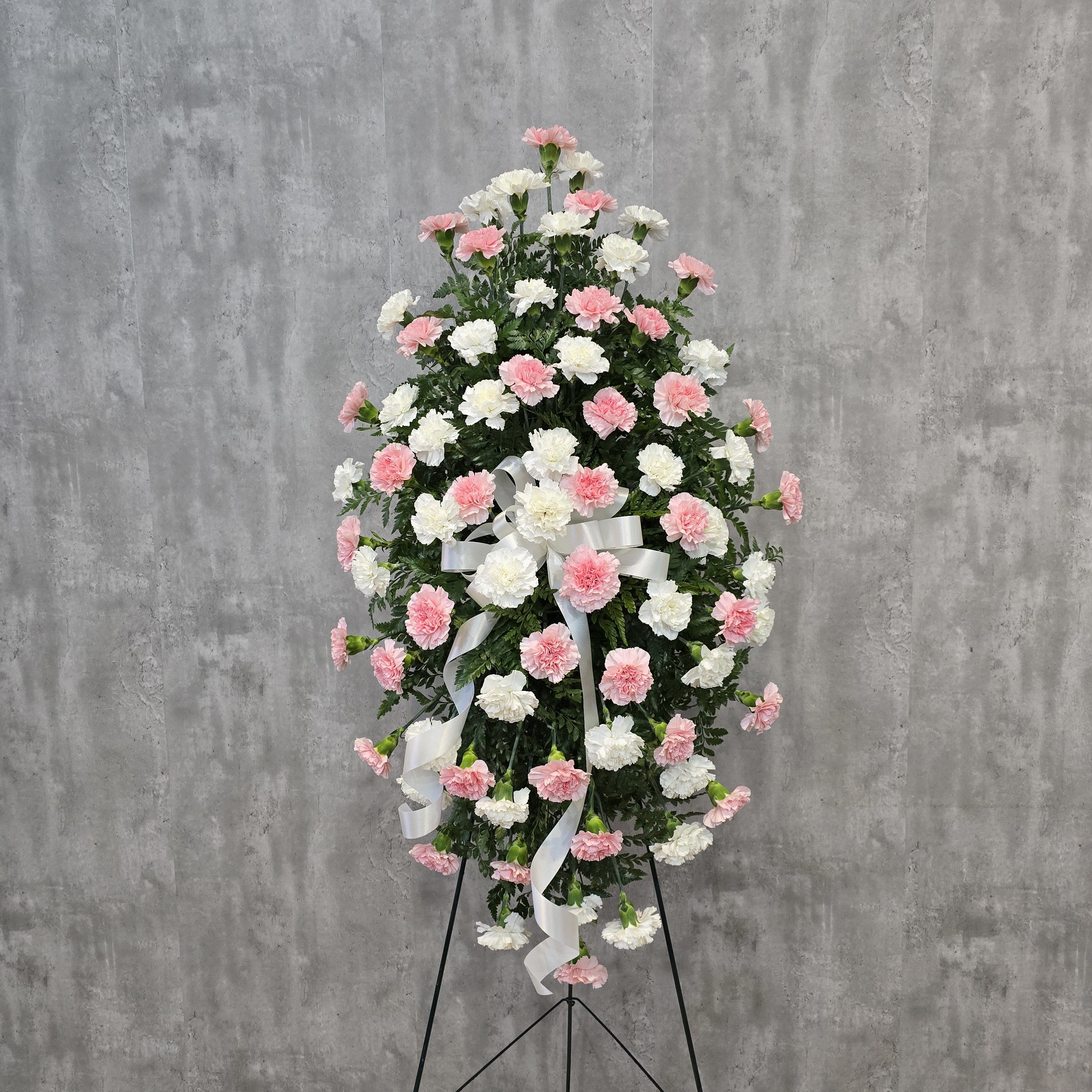 Classic Carnation Easel Spray - Carnations are a classic! This easel is made with white and pink, and the colors can be changed to one solid color or any assortment of multiple colors.