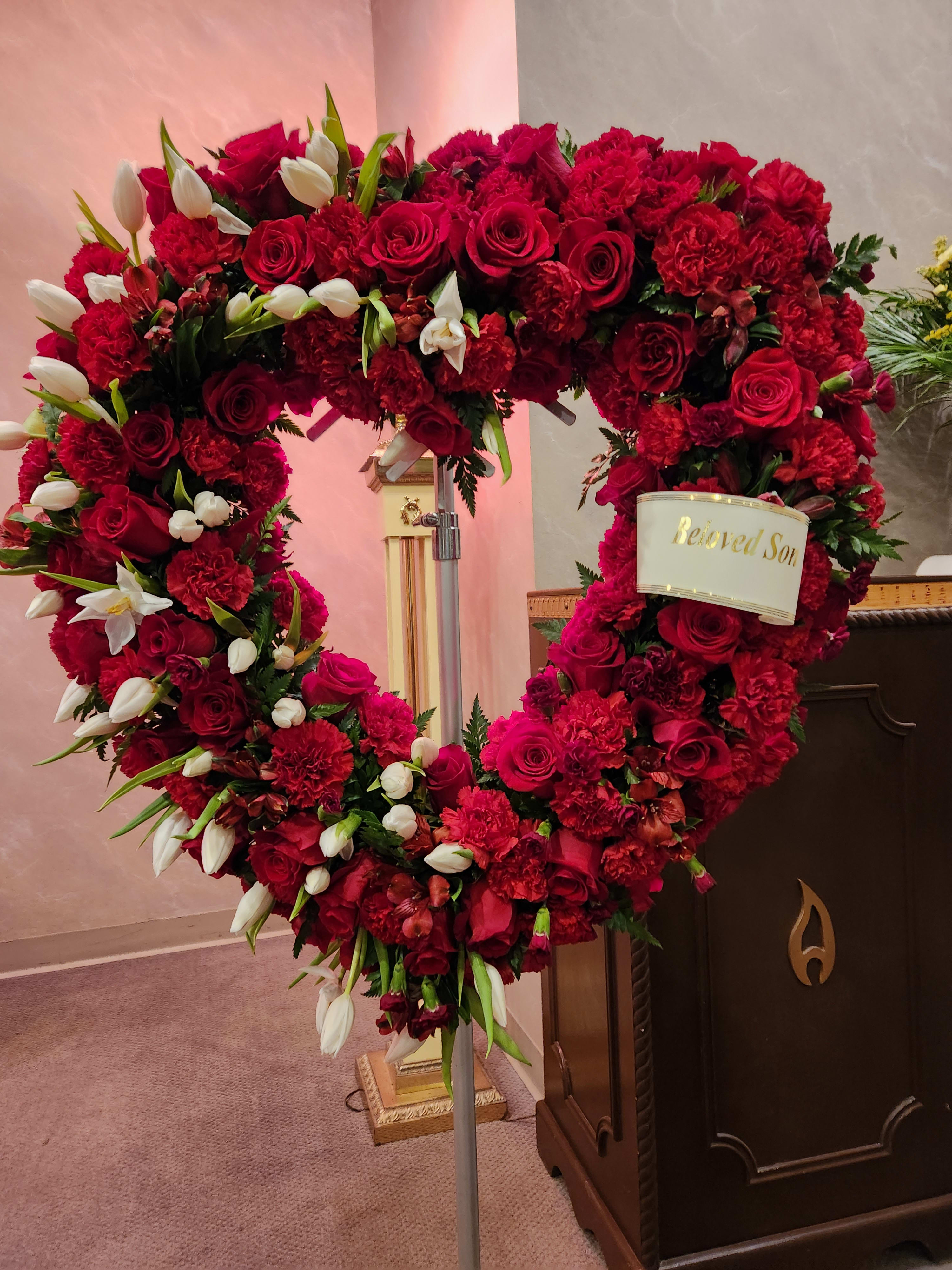 Forever  Blesed Red heart and white Tulip  - A loving remedymdrance of a Red heart wreath. Accented with what  flowers  . Perfect for  any  memorial , Funeral  , service or remedymdrance 