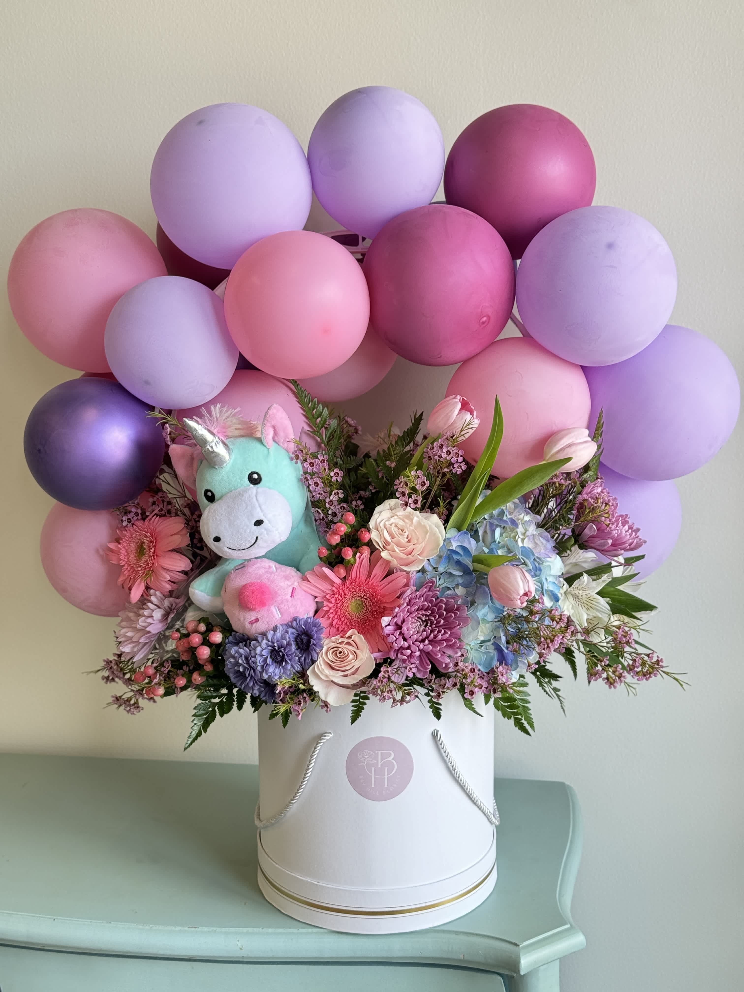 Birthday Bash!  - Give the all-in-one gift of balloons, flowers and a plush unicorn that plays &quot;happy birthday&quot; tune!   Call in to customize and see if same day delivery is available. 