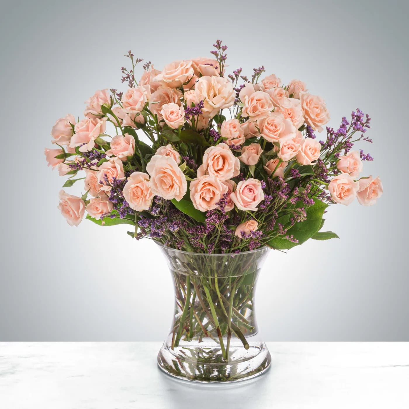 Rose Gold by BloomNation™ Rose Gold by BloomNation™ - A chic twist on sending somebody the classic dozen, spray roses are a great way to say you care in a lot of ways. Send blush spray roses for Breast Cancer Awareness Month, International Women's Day, or just because. 1st Image: Standard 2nd Image: Premium