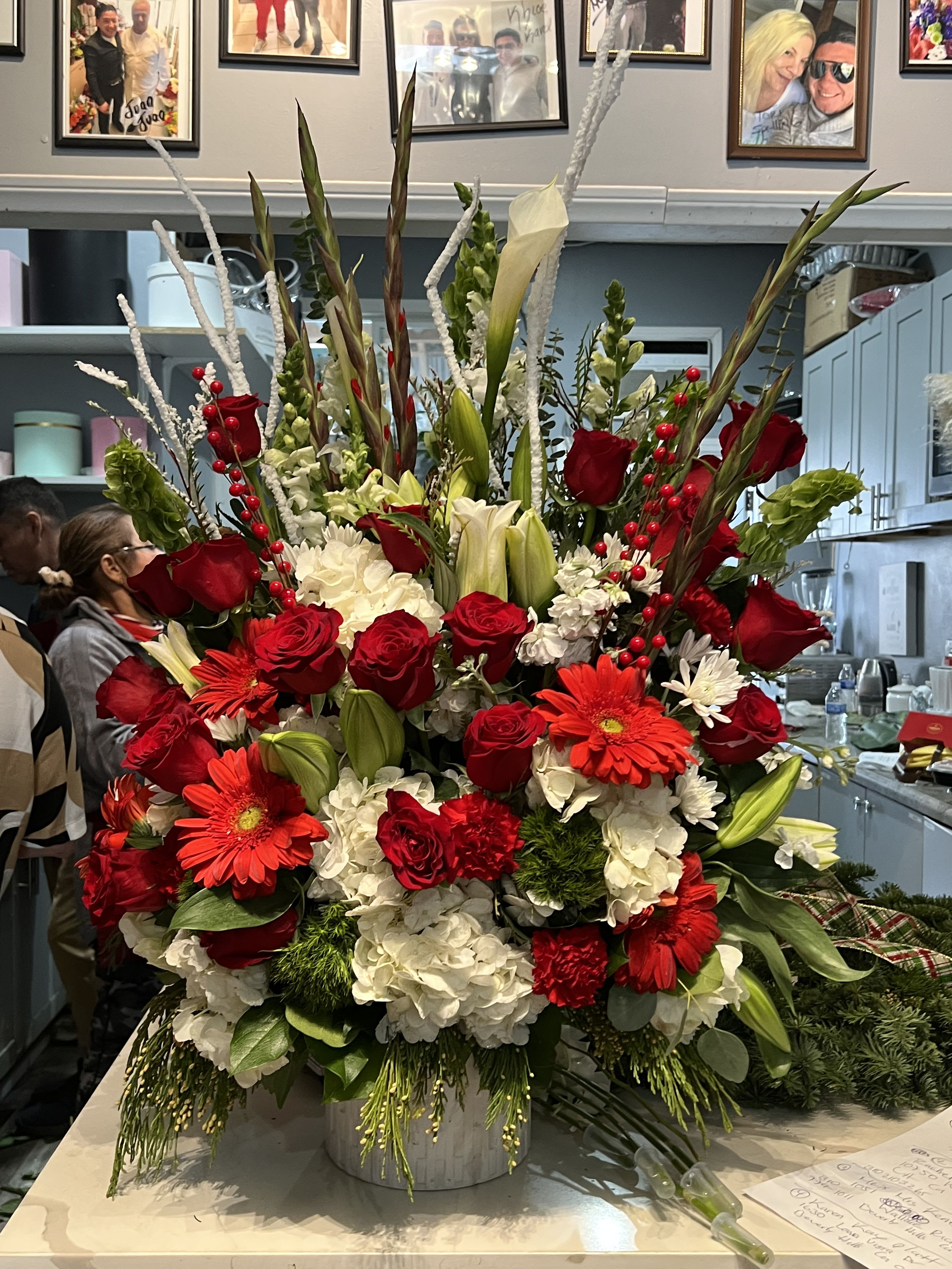 Lady in red - Stunning Arrangement of white  hydrangeas, Cala Lilies, oriental lilies lisiuntus and full of red roses in a beautiful elegant ceramic container 