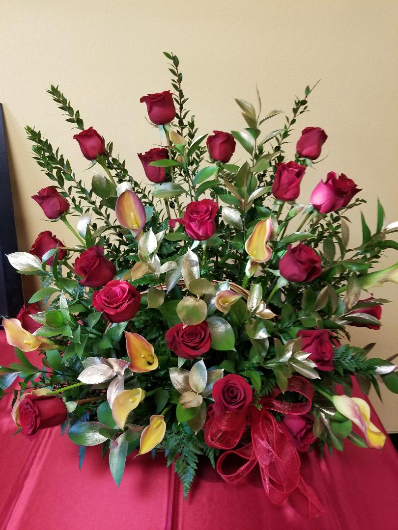 RED ROSES WITH CALLA LILLIES (DESIGNER CHOISE) RED ROSES WITH CALLA LILLIES (DESIGNER CHOISE) - 24 RED ROSES WITH 10 CALLA LILLIES (DESIGNER CHOISE MEANS WE WILL USE THE COLOR OF CALLA LILLIES AVAILABLE WHEN YOU PLACE YOUR ORDER) CALLA LILLIES COME IN WHITE, ORANGE/RED, PURPLE, YELLOW AND A DEEP BLACK.