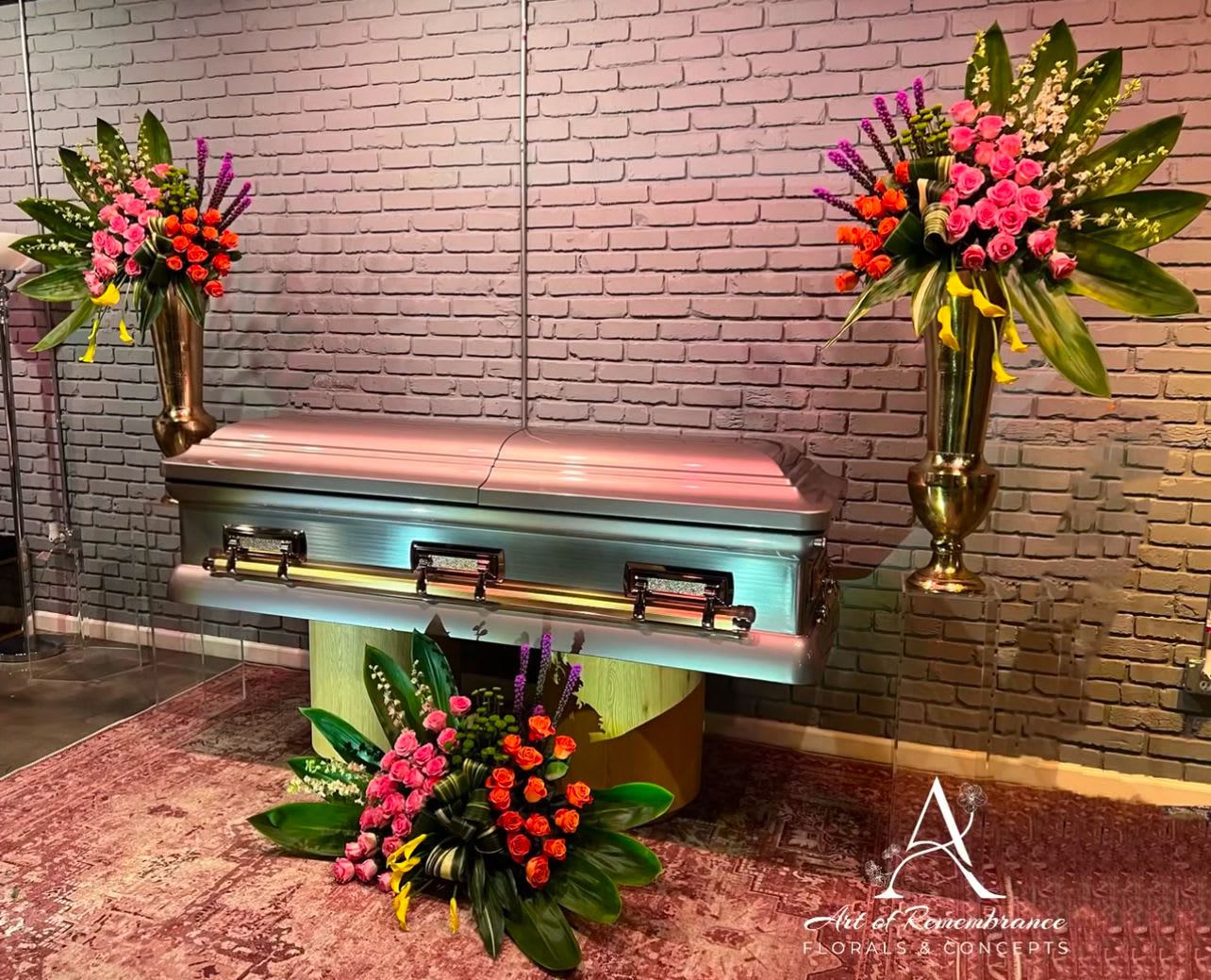 Violet Bouquet by Art of Remembrance - This floral arrangement offers a unique and different expression of love. Adorned with roses, yellow calla Lillie’s and more. Simple elegance. 