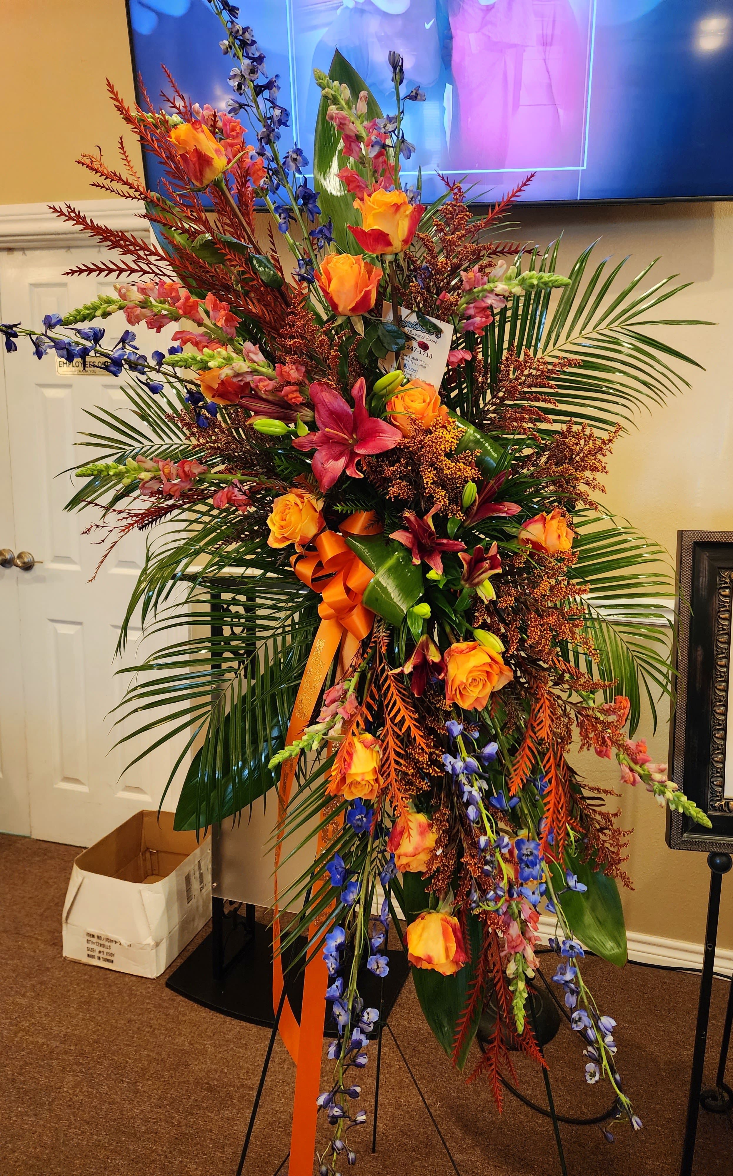 Sunset Safari - Orange roses, stock, lilies, and greenery. 