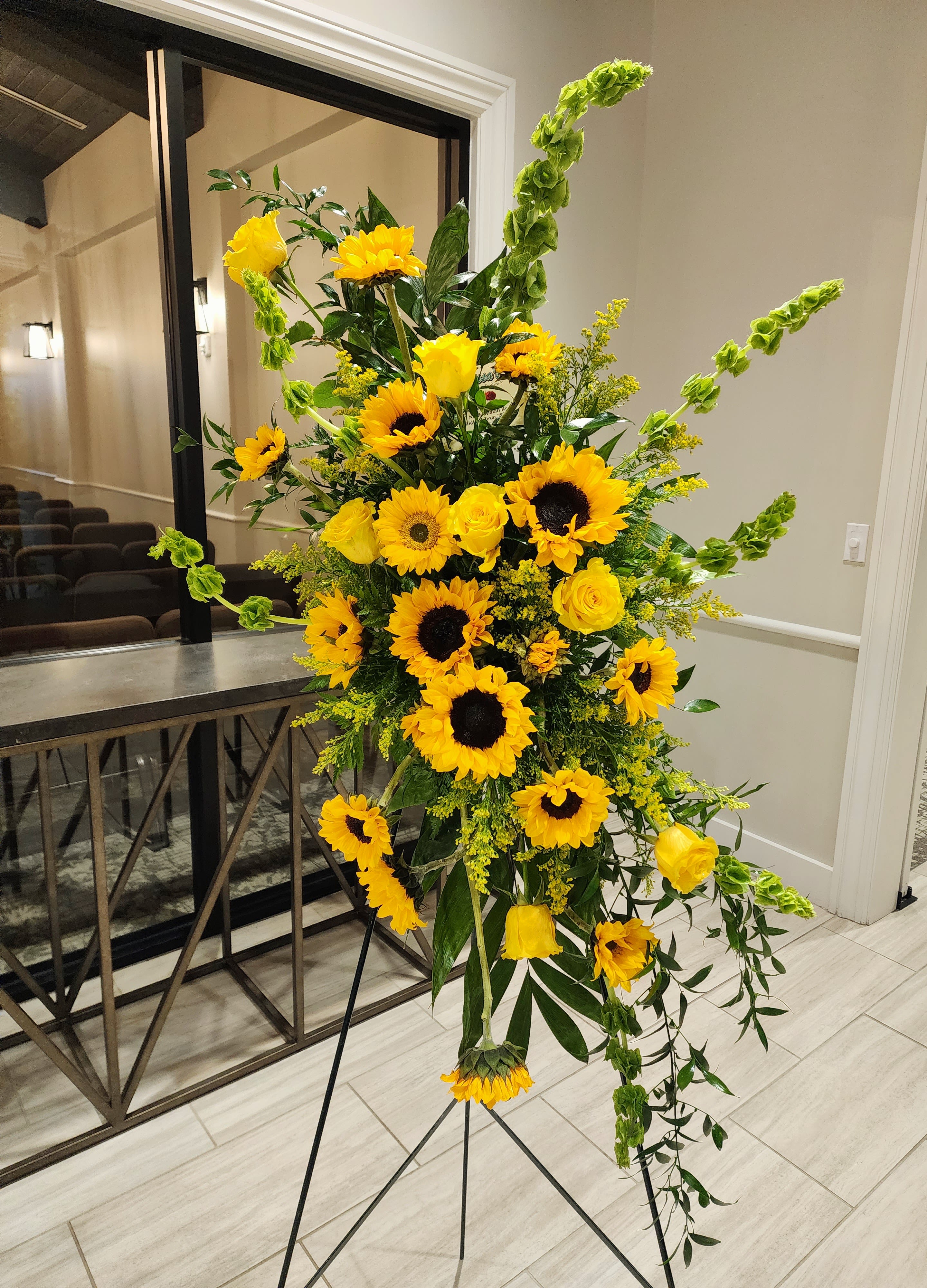 Sunflower Sunshine - Yellow roses, yellow sunflowers, bells of Ireland, and greenery.