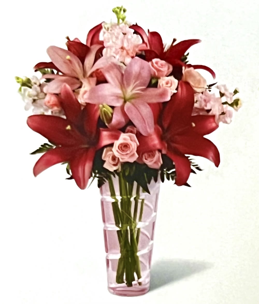 Loving Thoughts - Hand-arranged to perfection within a pink glass vase, this pink lilies arrangement bursts with elegance and grace to express your unending devotion and love to that special someone.   DETAILS Pink flowers and dark pink Asiatic lilies, pink spray roses, and fragrant pink stock stems are accented with lush greens, to create an exceptionally pretty arrangement of flowers sure to bring a smile to your loved one's face.   VASE INCLUDED Orientation: One-Sided Item #NF-485  FLORIST-TO-DOOR Same day flower delivery on most orders placed online by 12 pm or 10 am on weekends PST.  BLOOM DETAILS Spray Roses Stock Asiatic Lilies Greenery  The Standard Arrangement is approx. 19&quot; H x 15&quot; W. The Deluxe Arrangement is approx. 20&quot; H x 16&quot; W. The Premium Arrangement is approx. 21&quot; H x 17&quot; W.  How to place an order? 1. You can place an order directly on this secure website OR 2. You can call in your order by dialing: (323) 262 - 9238 OR 3. You can visit our store (appointment recommended 323.262.9238)  NINFA'S FLOWERS 2405 WHITTIER BLVD. LOS ANGELES, CA. 90023  ATTENTION: *Please note that on busy holidays, Valentine's Day, and Mother's Day, we cannot verify if the recipient received the flowers until the following day. You can verify delivery on the website after 10:00 pm, call 323.262.9238 the following day after 10:00 am, or contact the recipient directly. Thank you for your patience and understanding. 