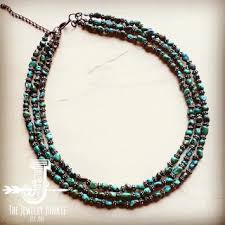 Triple Strand Natural Turquoise & Wood Collar Necklace Triple Strand Natural Turquoise & Wood Collar Necklace - Gorgeous statement piece. Natural gemstone necklace. Length: 18”-24" with an extender chain. Mix and match with our entire catalog of natural turquoise stones. Every jewelry junkie piece is handmade, so while the piece that you receive will look similar to the one in the picture, no two are exactly alike.