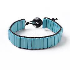 Woven Howlite Turquoise Stacked Stone Bracelet Woven Howlite Turquoise Stacked Stone Bracelet - Elevate your style with our handcrafted Woven Howlite Turquoise Stacked Stone Bracelet. Made with stunning turquoise stones, this boho-inspired bracelet adds a touch of western flair to any outfit. Expertly woven for a unique and textured look, making it a must-have accessory. * 12mm wide beads * Genuine Howlite Turquoise natural stones * Adjustable to 6.5" up to 9" as shown * Although your item will resemble the photo, each piece is created by hand, so no two are identical.