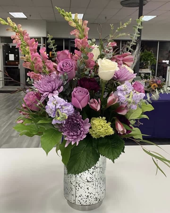 For the Purple Girl  - A large variety of all the shades of purple. A full dozen roses mixed with all our favorite purple accents. 