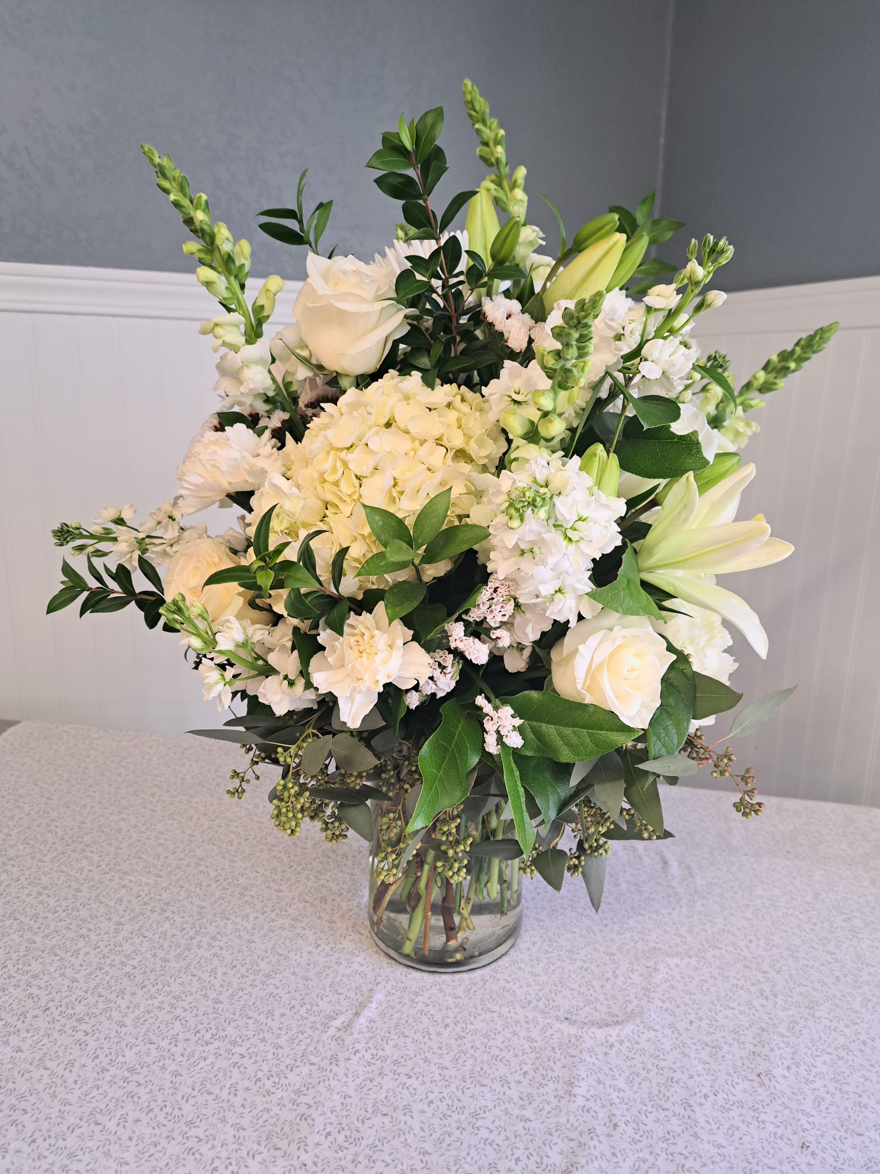 Everlasting Serenade - Our all white bouquet is peaceful and stunning. If you can't serenade them with song, serenade them with flowers. 