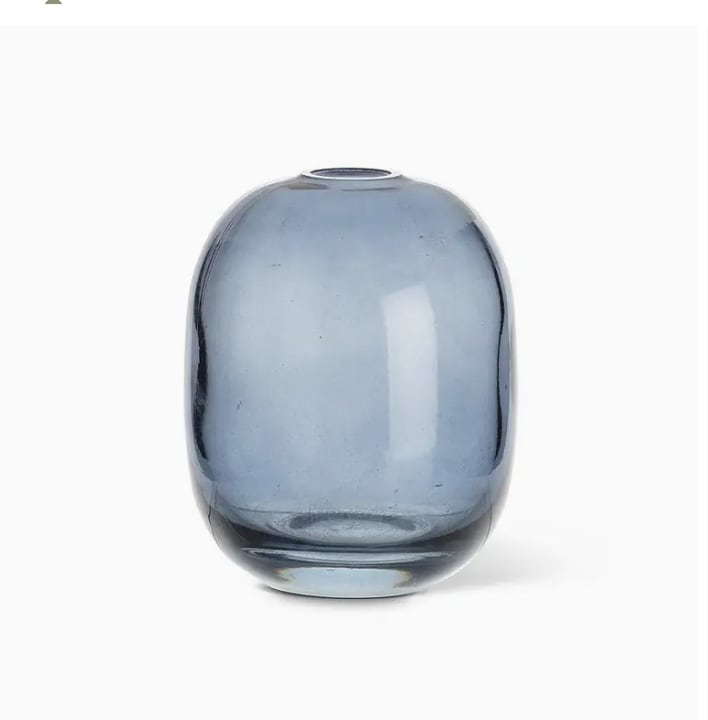 Medium Barrel Bud Vase - Blue - Introducing our Medium Barrel Bud Vase from Chartreuse by Roje—a perfect blend of elegance and modern design. Crafted from premium quality glass, this vase features a sleek, barrel-shaped silhouette in a rich, dark navy hue that adds a moody and sophisticated touch to any space. Its slender form is ideal for showcasing single blooms or petite floral arrangements, effortlessly elevating your home decor. Whether styled alone or grouped with other pieces, this artfully designed vase brings a refined pop of personality and timeless charm to your interior. Add a touch of understated luxury to your living space with this stunning piece from Chartreuse by Roje. They measure 4.5&quot; in height.