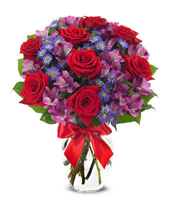 Life's Rosy Bouquet Life's Rosy Bouquet - Nothing proclaims "I Love You" quite so magically, and so tenderly...as roses. This magnificent arrangement boasts a glorious combination of red roses, purple alstroemeria and purple Monte Casino blooms in a pretty rose vase with bright red satin ribbon. Small Measures 14"H by 11"L. Medium Measures 15"H by 12"L. Large Measures 16"H by 13"L.