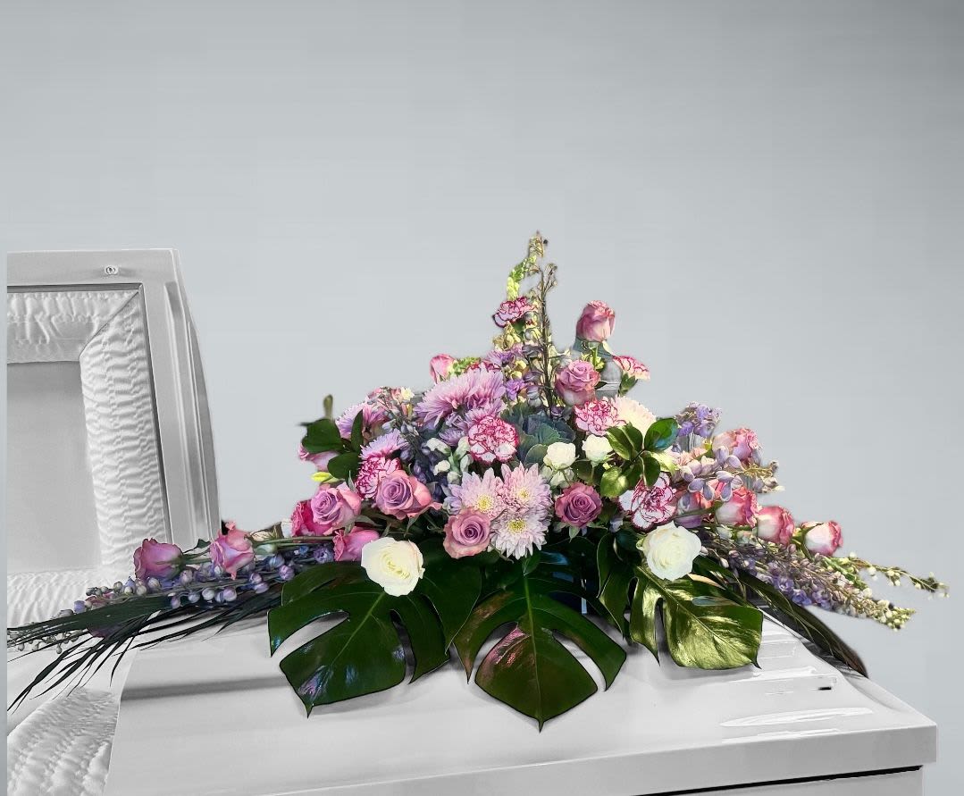 Elegant Elegance Elegant Elegance - Our arrangement is a beautiful floral composition in pastel tones, evoking a feeling of peace and tranquility; perfect for expressing your condolences.
