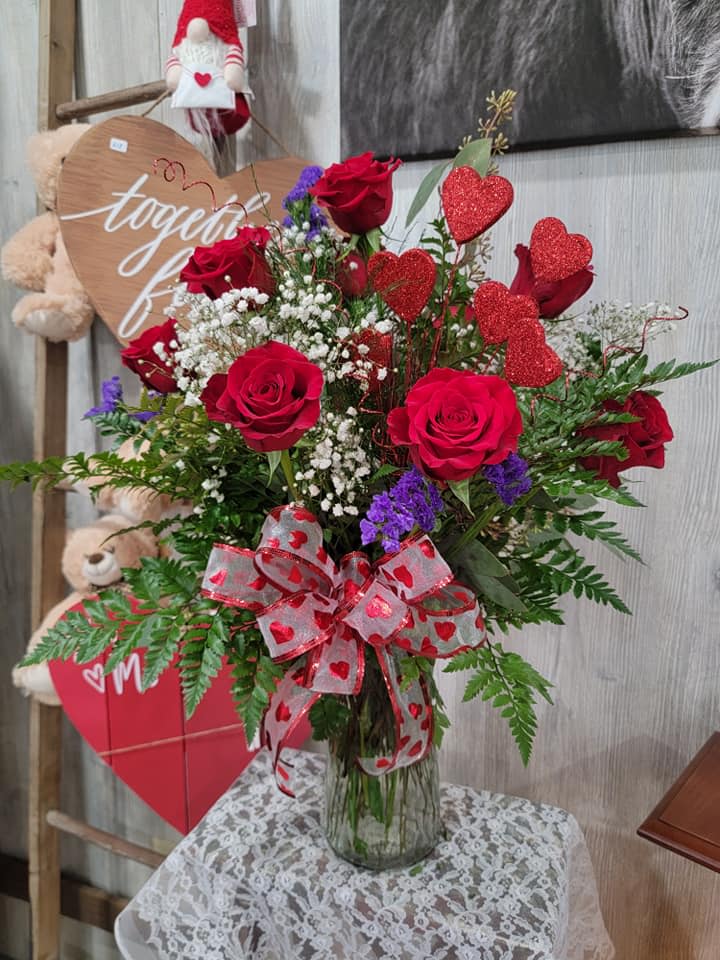 Dozen Hearts - A traditional dozen red roses with beautiful greenery and filler! A great way to say I Love You.