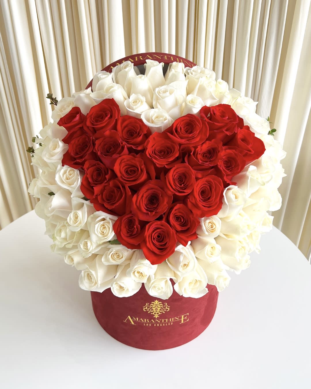 Eternal Love Eternal Love - Celebrate the timeless bond of love with our "Eternal Love" flower arrangement, a breathtaking display that speaks volumes of affection. In the shape of a heart, this extraordinary ensemble features alluring red roses forming the inner heart, surrounded by a delicate layer of pure white roses, beautifully presented in an elegant red box. The deep red roses at the core signify passionate love and devotion, while the surrounding white roses symbolize purity and eternal commitment. Together, they create a striking contrast, portraying the depth of emotions shared between two hearts intertwined.