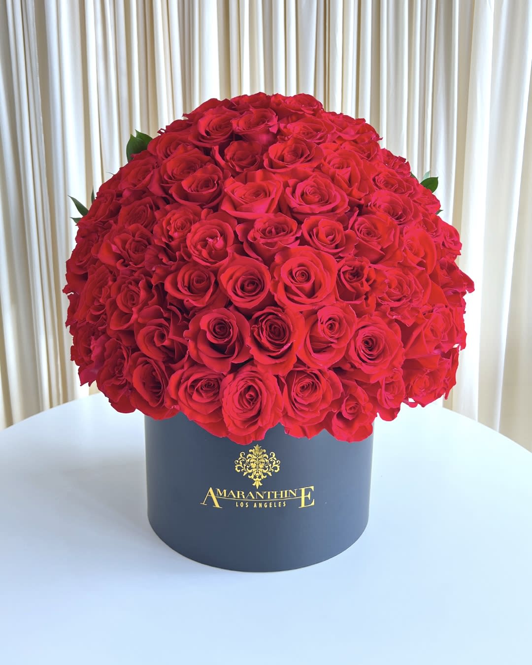 Eternal Embrace Eternal Embrace - Experience the eternal beauty of "Eternal Embrace," a captivating flower arrangement featuring a stunning ensemble of all red roses, elegantly presented in a beautiful black box. This enchanting creation exudes timeless romance and sophistication, making it an exquisite gift for cherished moments and expressions of everlasting love. The deep crimson red roses symbolize enduring passion and devotion, speaking volumes of the profound emotions that bind hearts together. Each bloom is meticulously selected for its pristine beauty, ensuring that "Eternal Embrace" becomes a visual representation of the true essence of love.