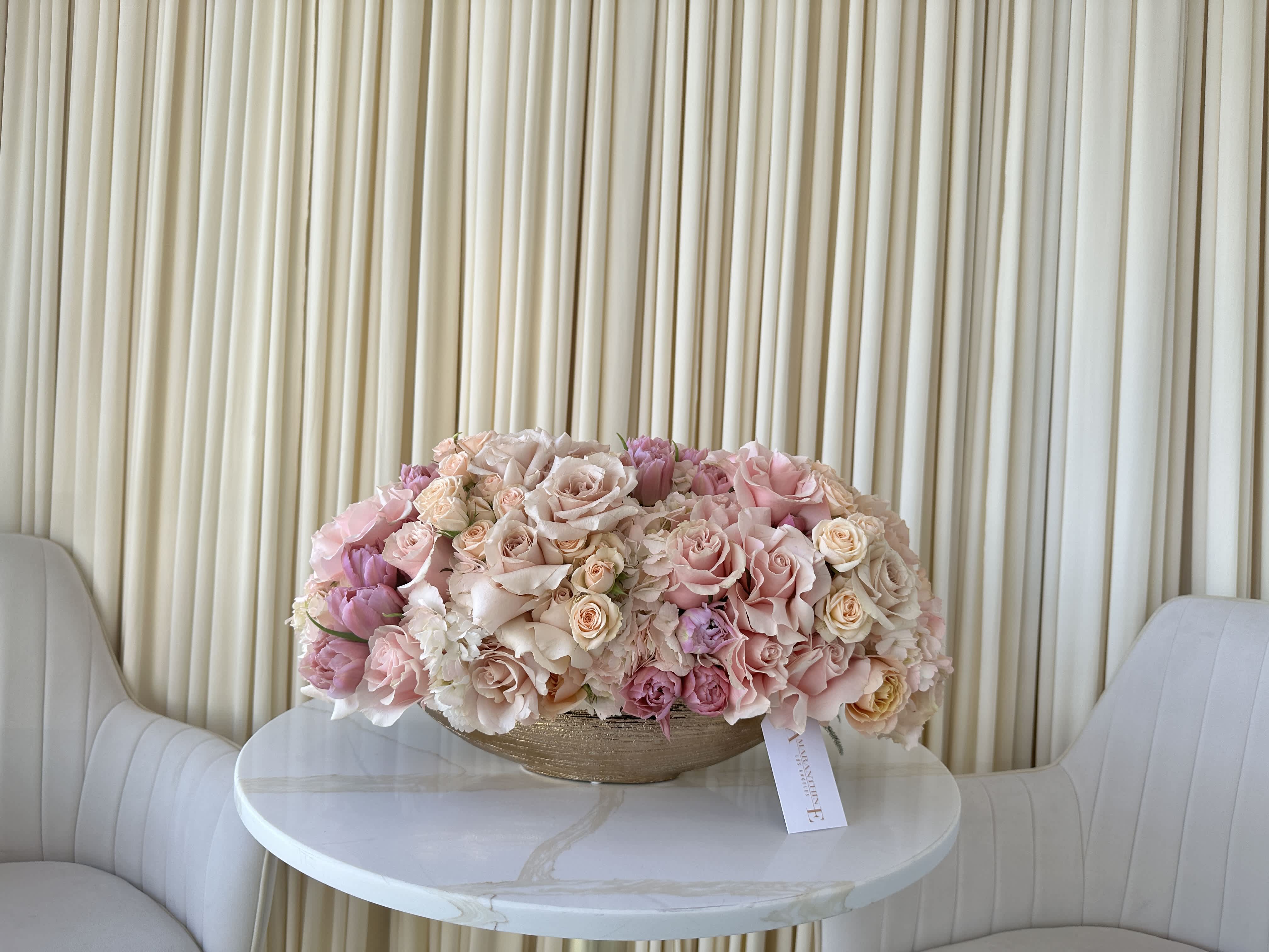 Springtime Dream - Soft and airy, this springtime bouquet is a dream come true.  Delicate peach baby roses and fluffy blush hydrangeas create a romantic and textural foundation. Elegant lavender tulips add a pop of color, while soft pink roses complete the arrangement with a touch of classic beauty.