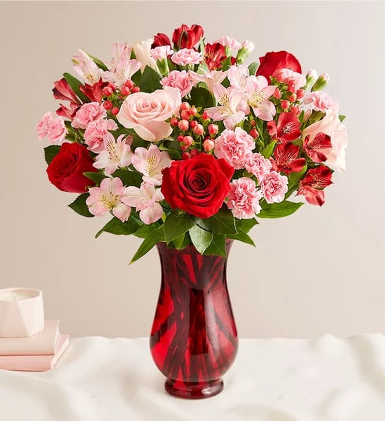 Expression of Love Expression of Love - A captivating harmony of pink and red blooms, this arrangement radiates passion and grace. The soft blush of pink flowers blends beautifully with the vibrant crimson tones, creating a stunning display of romance and charm. Perfect for expressing heartfelt emotions, this bouquet is a timeless celebration of love and beauty. Description: Roses-pink and red, pink carnations, red alstromeria, pink mini carns