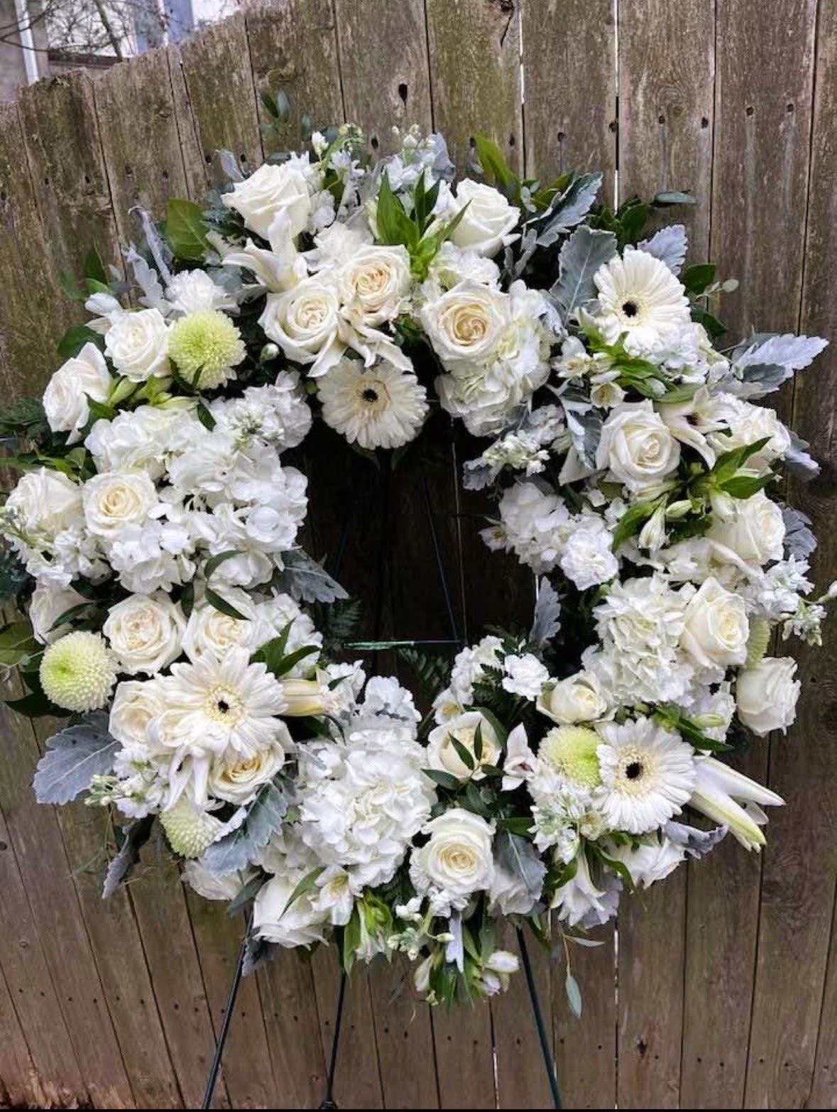 Blanc - Beautiful white wreath, which includes some gerber daisies, white roses, hydrangea, and more gorgeous white flowers mixed with greens. Approximately 20-24 inches for a smaller wreath and 30-36 inches for a larger wreath. 