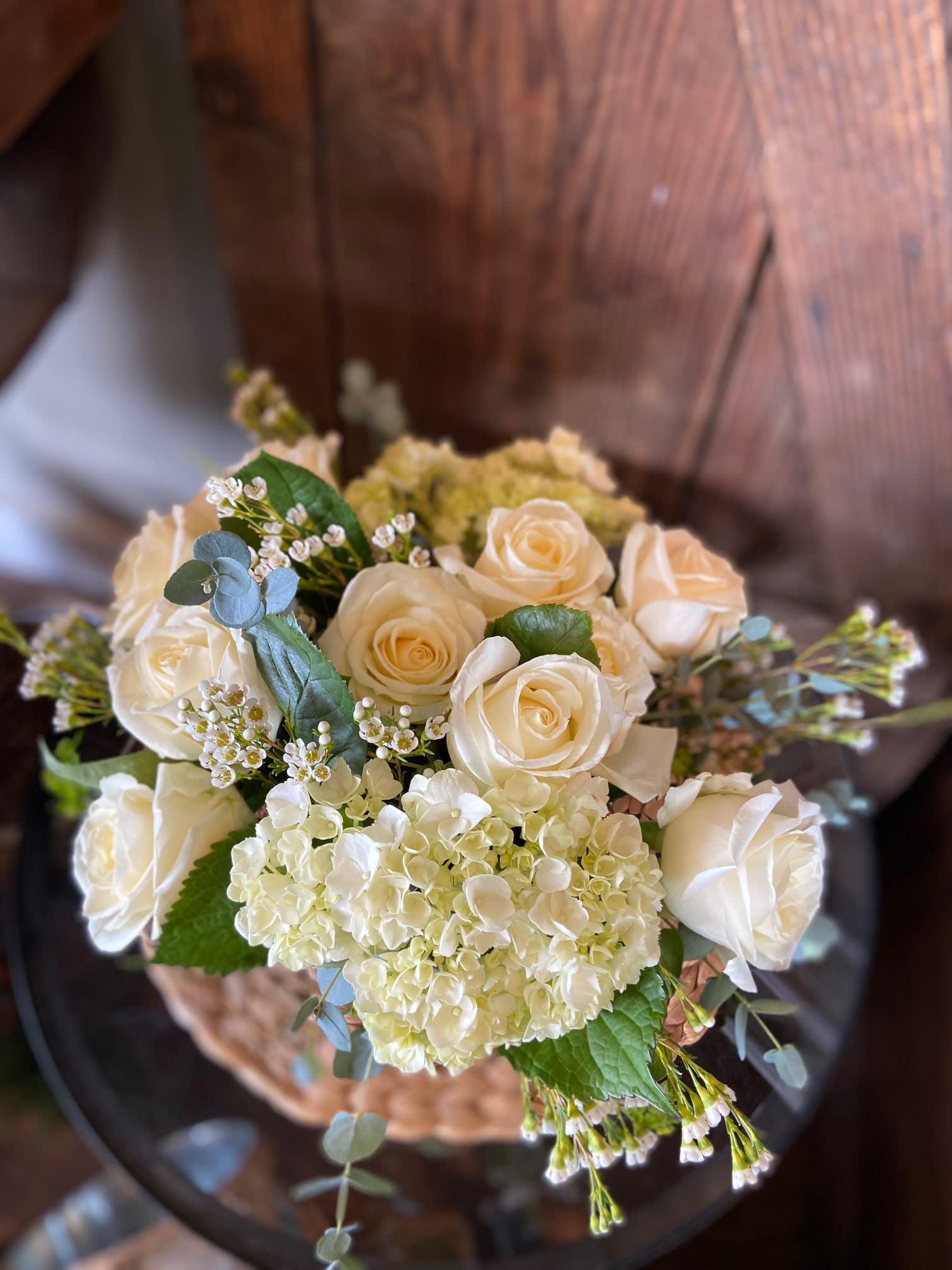 Simple Elegance - White roses, Hydrangeas, Eucalyptus, and Wax Flower Designed for a Simply Elegant Gift.