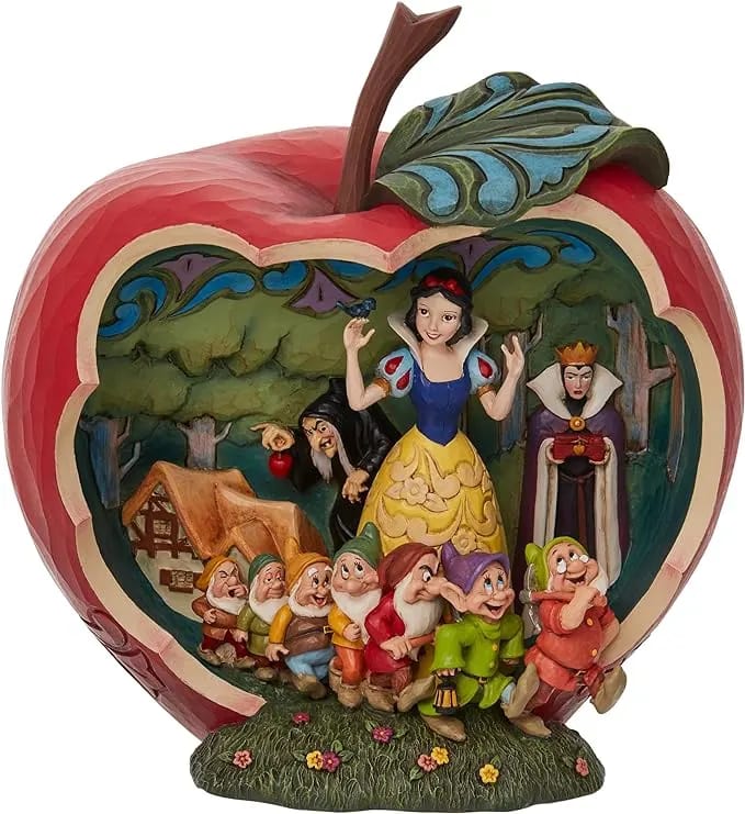 DISNEY COLLECTIONS - " A wishing apple" -SNOW WHITE on Disney Traditions DISNEY COLLECTIONS - " A wishing apple" -SNOW WHITE on Disney Traditions - Snow White, The Seven Dwarfs, the Evil witch, The Queen Step Mother- Packaged In An Individual Box With Photo On Front. Beautifully Hand-Painted Jim Shore Disney Traditions Collection Great Addition For A Disney Collector And Home Decor! Perfect For Gift Giving. Presented In Gift Box