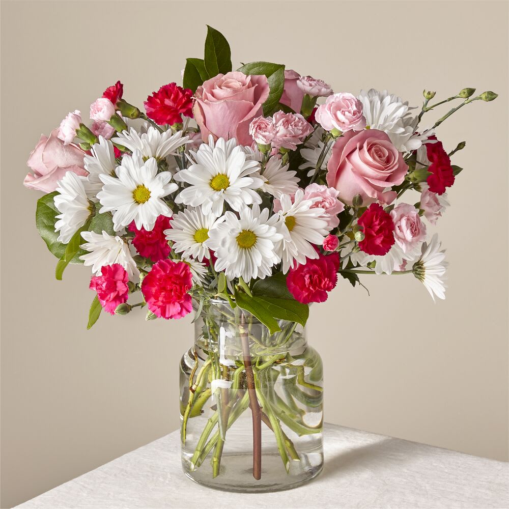 Sweet Surprise Bouquet Sweet Surprise Bouquet - Whether it's for an occasion or a pick–me–up for yourself, this sweet arrangement is ready to delight you or your loved ones.
